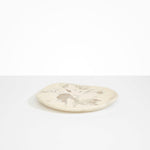 Dinosaur Designs Pebble Plate in Chalk Swirl color resin