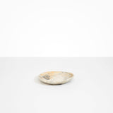 Dinosaur Designs Pebble Side Plate in Sandy Pearl color resin