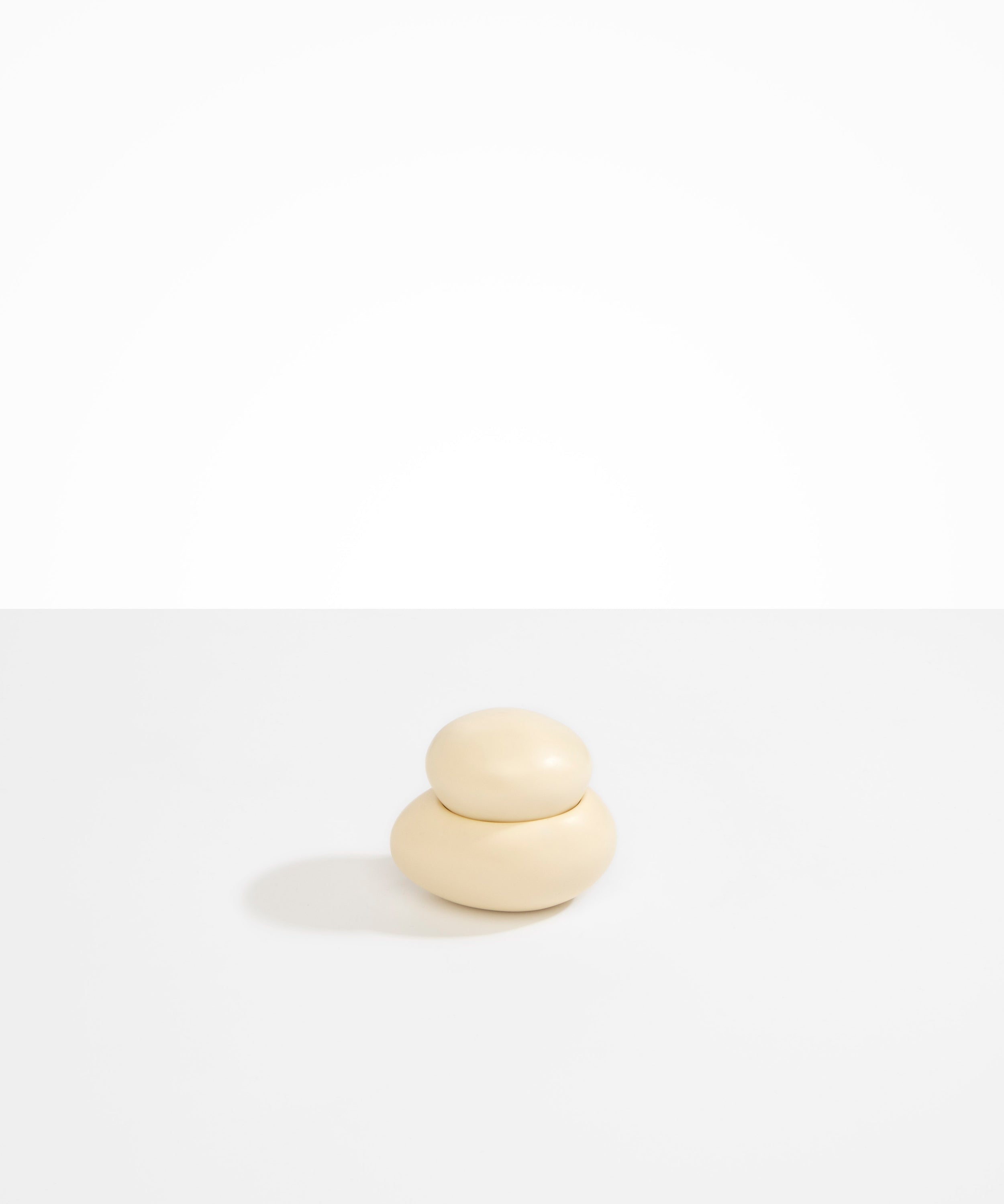 Dinosaur Designs Medium Pebble Jar in Cream color resin
