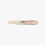 Dinosaur Designs Stone Cheese Knife in Sandy Pearl color resin