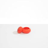 Dinosaur Designs JARPEBMED Medium Pebble Jar in Lychee orange color resin