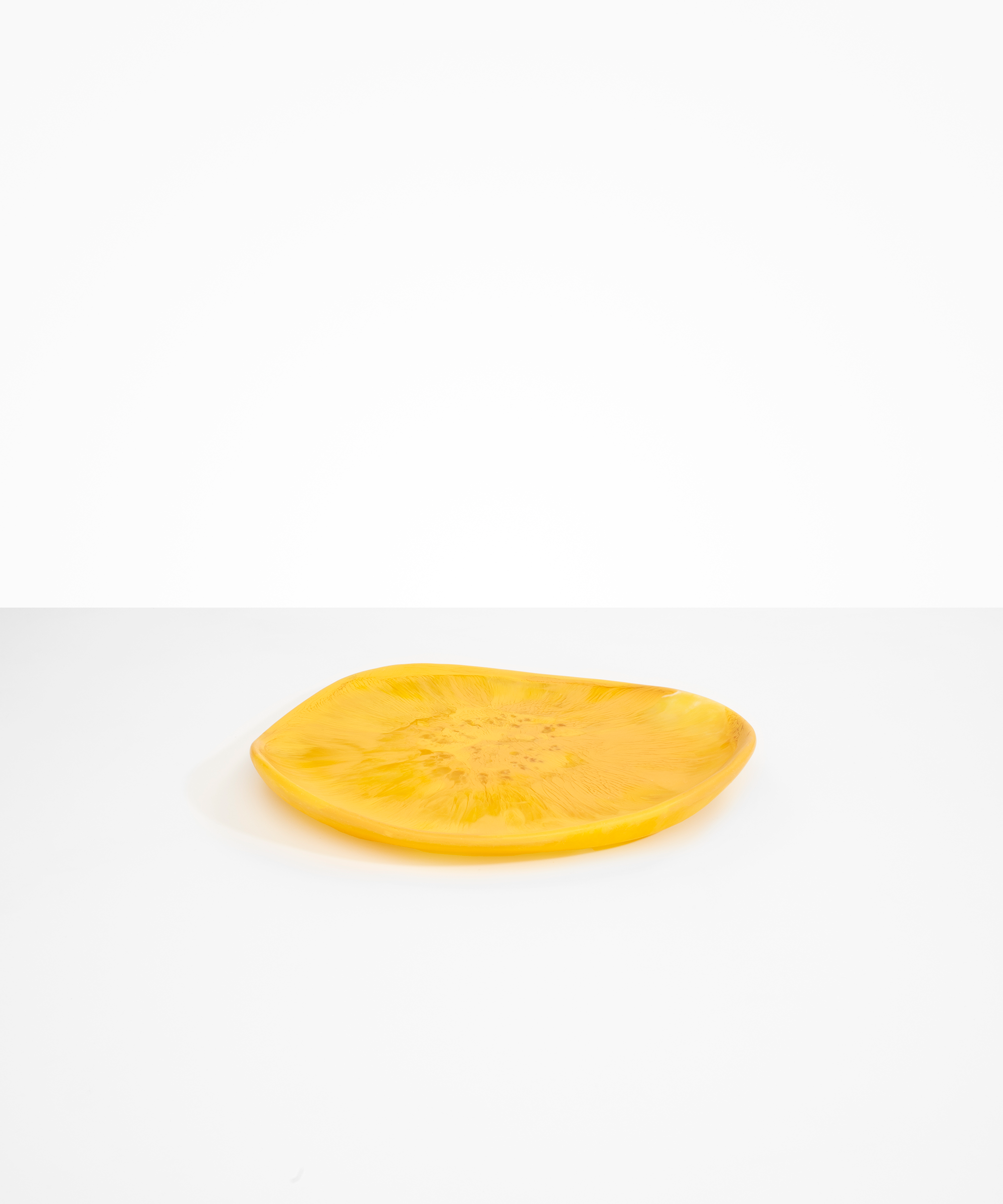 Dinosaur Designs Pebble Plate in Honeycomb color resin