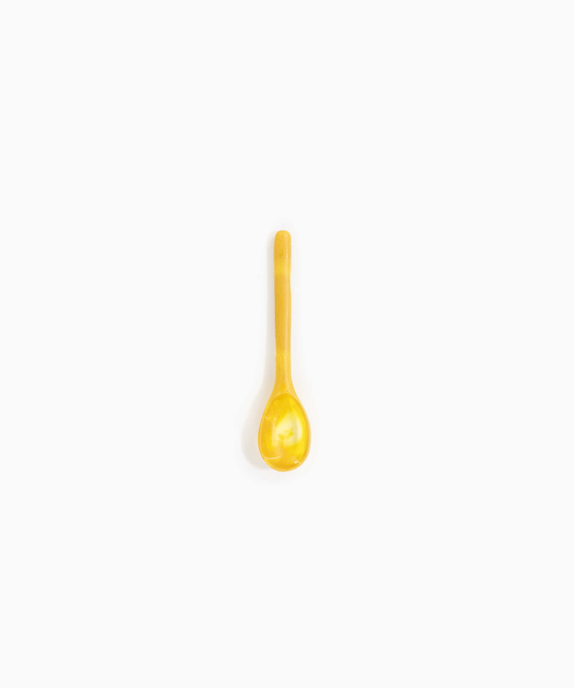 Dinosaur Designs Stone Spoon in Honeycomb color resin