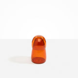 Dinosaur Designs colored Glass Pebble Carafe cup and jug set in amber orange.
