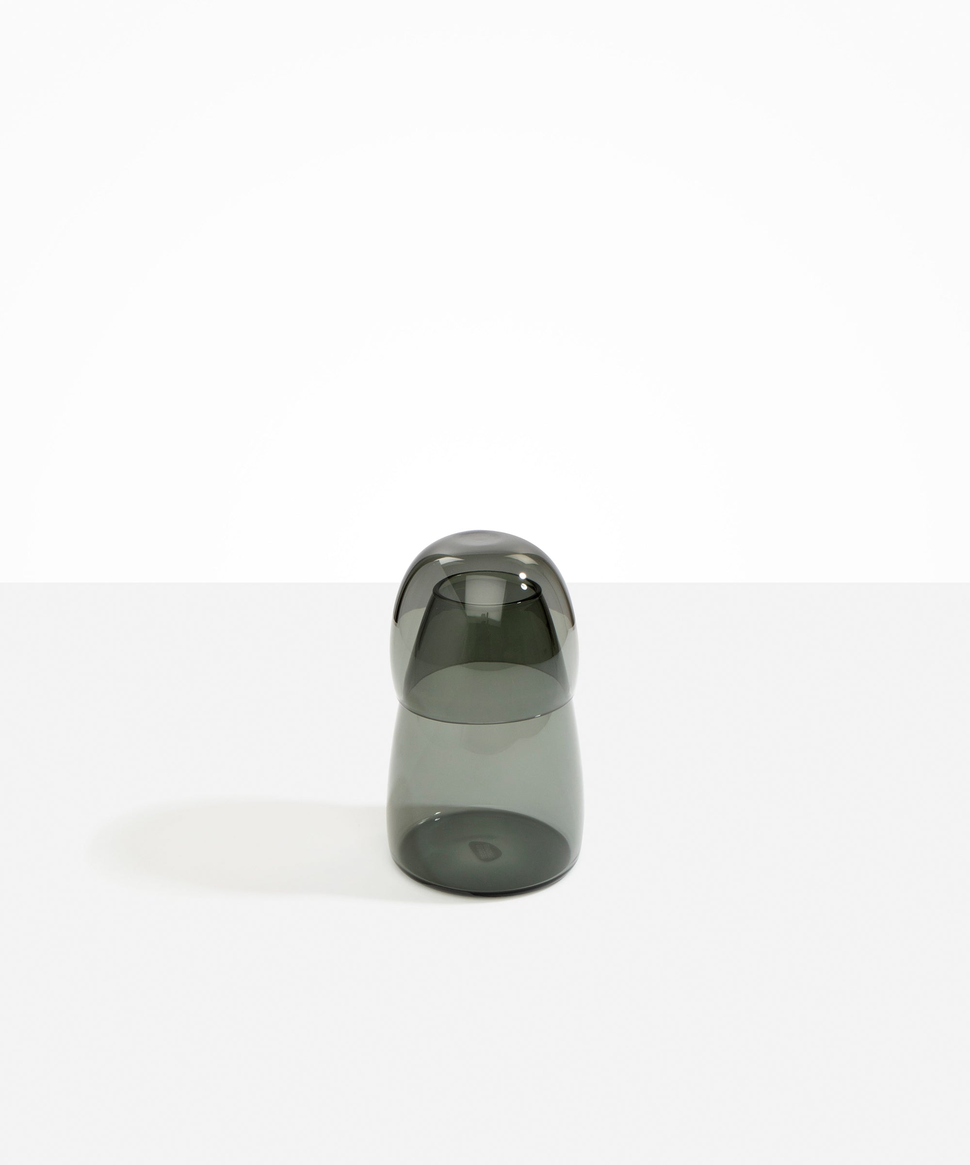 Dinosaur Designs colored Glass Pebble Carafe cup and jug set in transparent black.