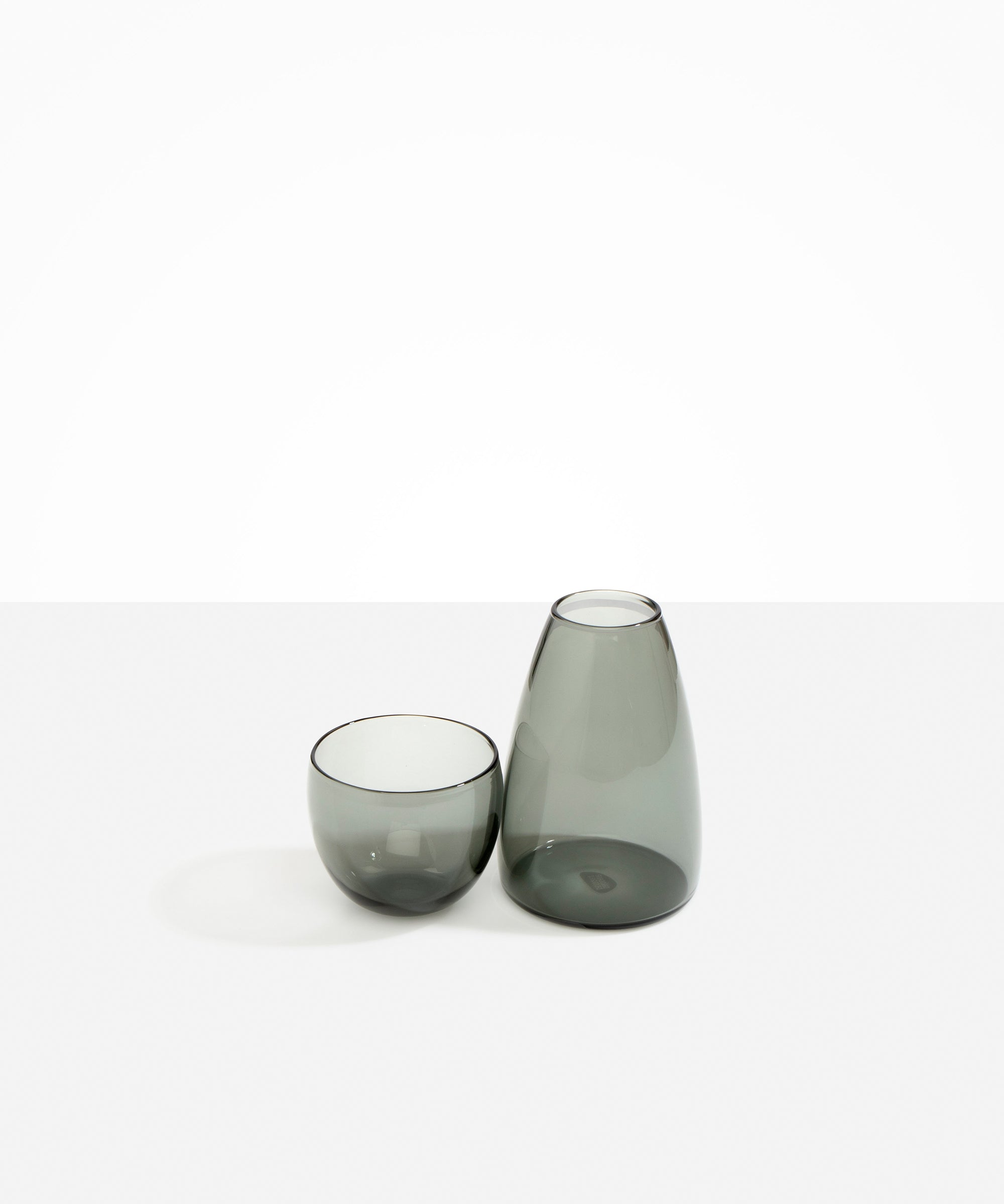 Dinosaur Designs Glass Pebble Carafe in Clear Black color resin