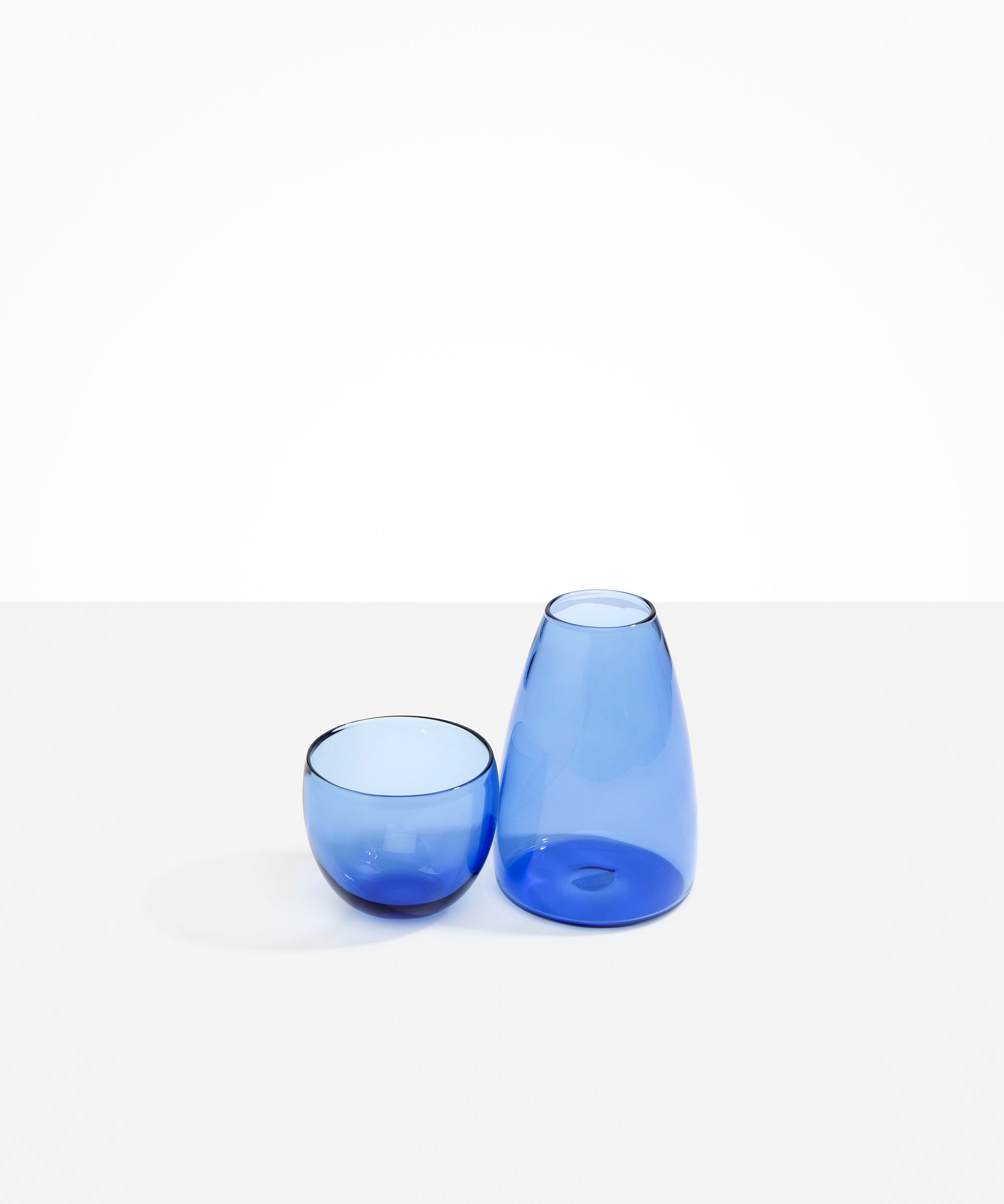 Dinosaur Designs Glass Pebble Carafe in Light Blue color resin