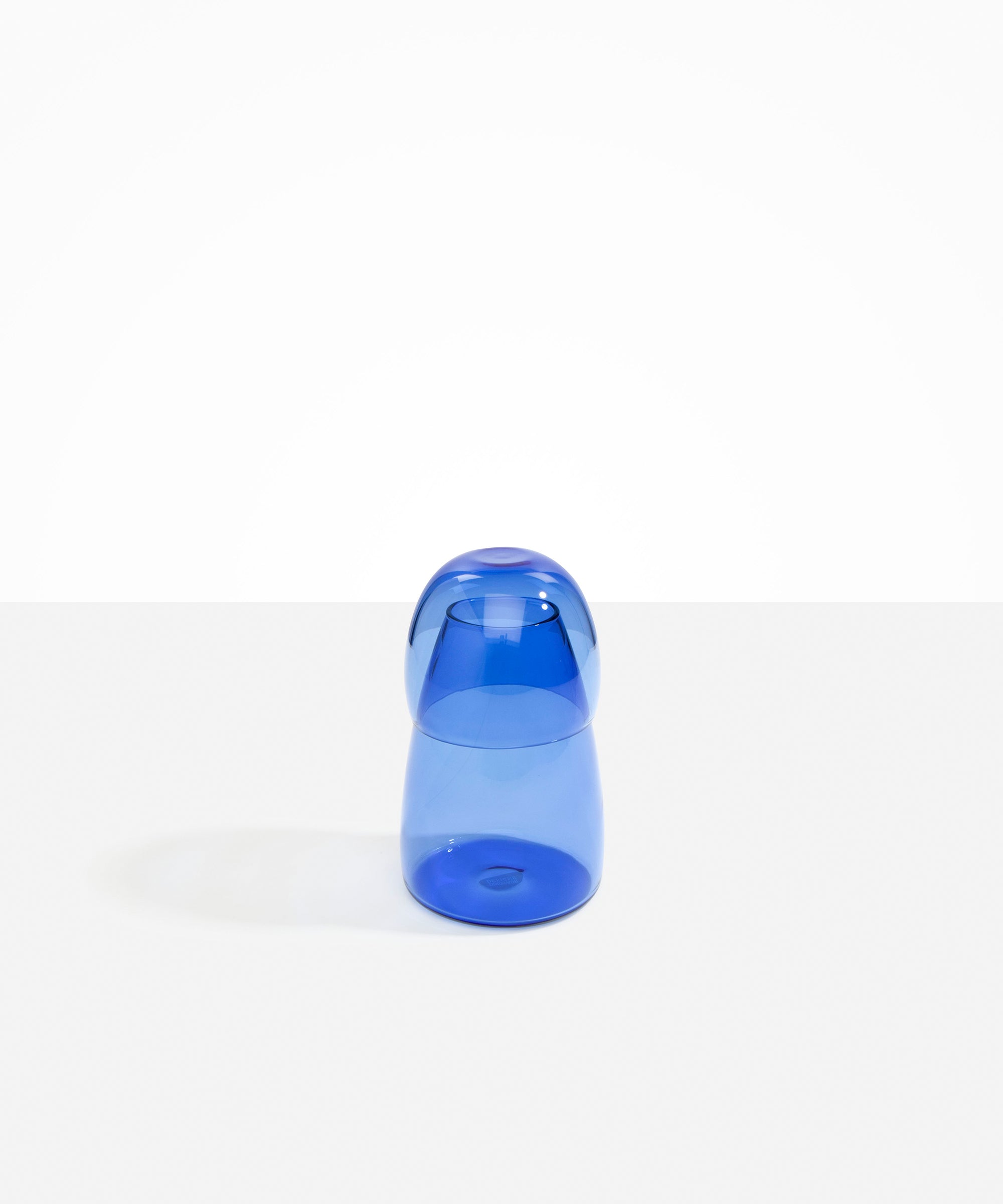 Dinosaur Designs colored Glass Pebble Carafe cup and jug set in light blue.