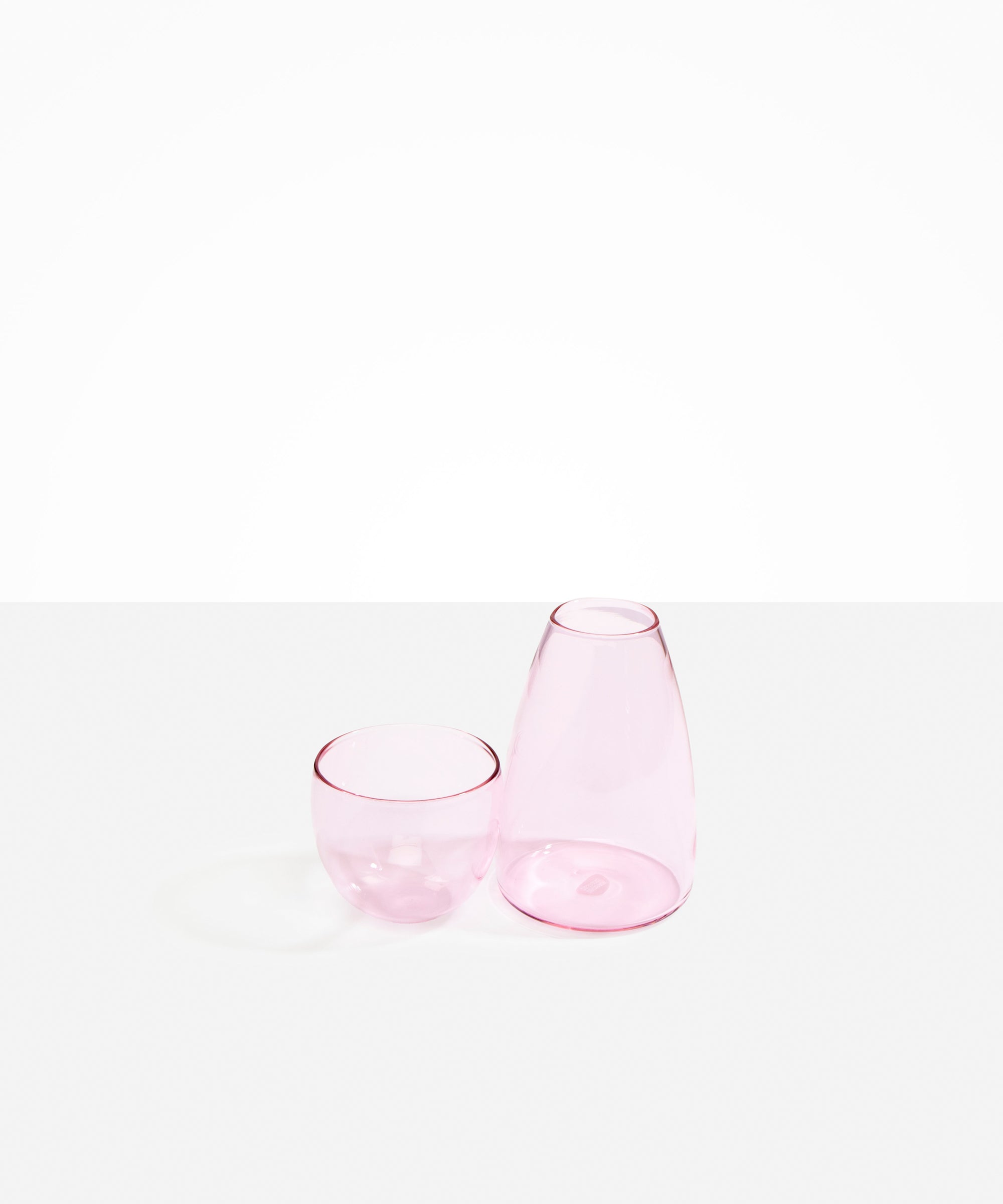 Dinosaur Designs Glass Pebble Carafe in Pink color resin