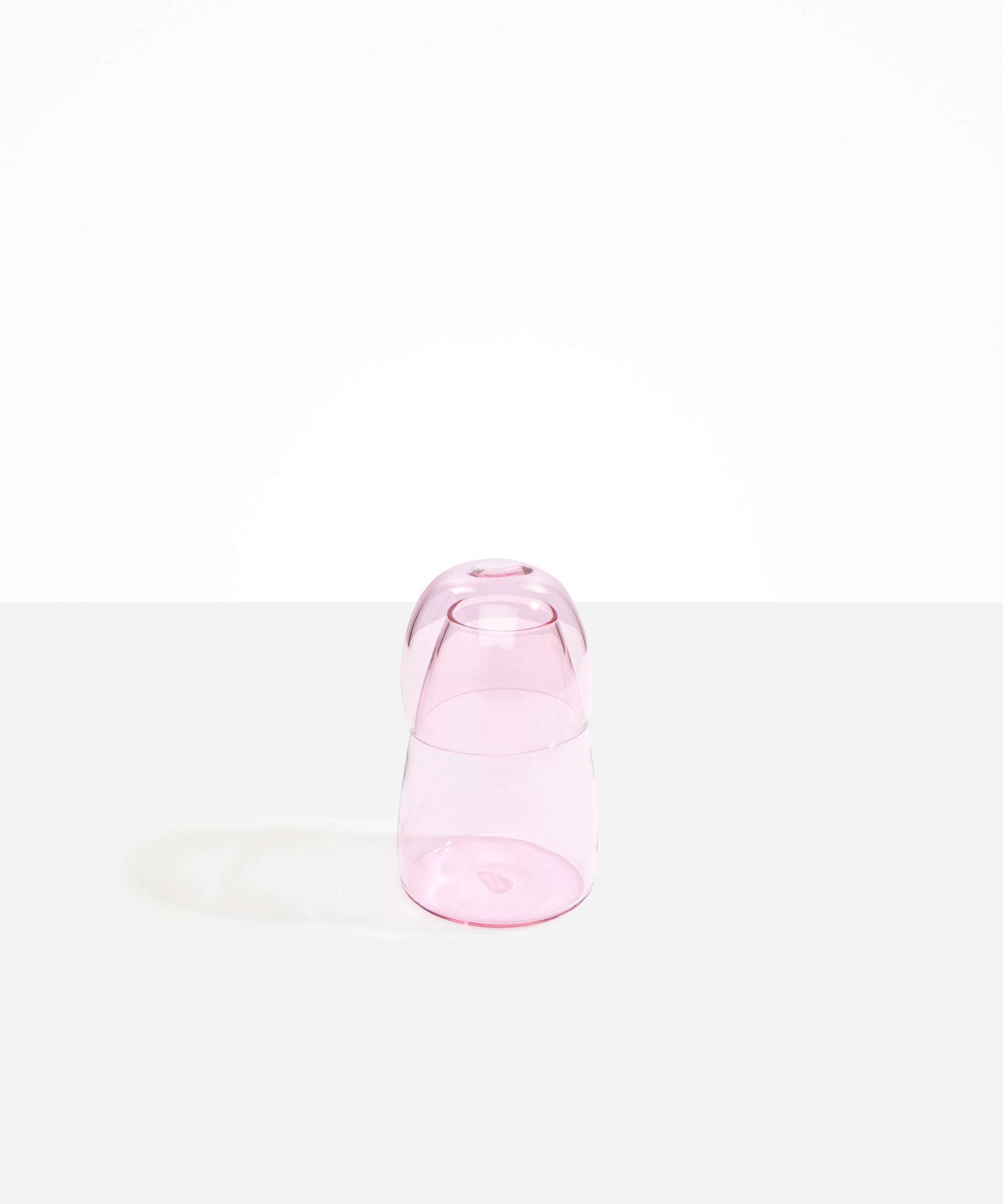 Dinosaur Designs colored Glass Pebble Carafe cup and jug set in transparent pink.