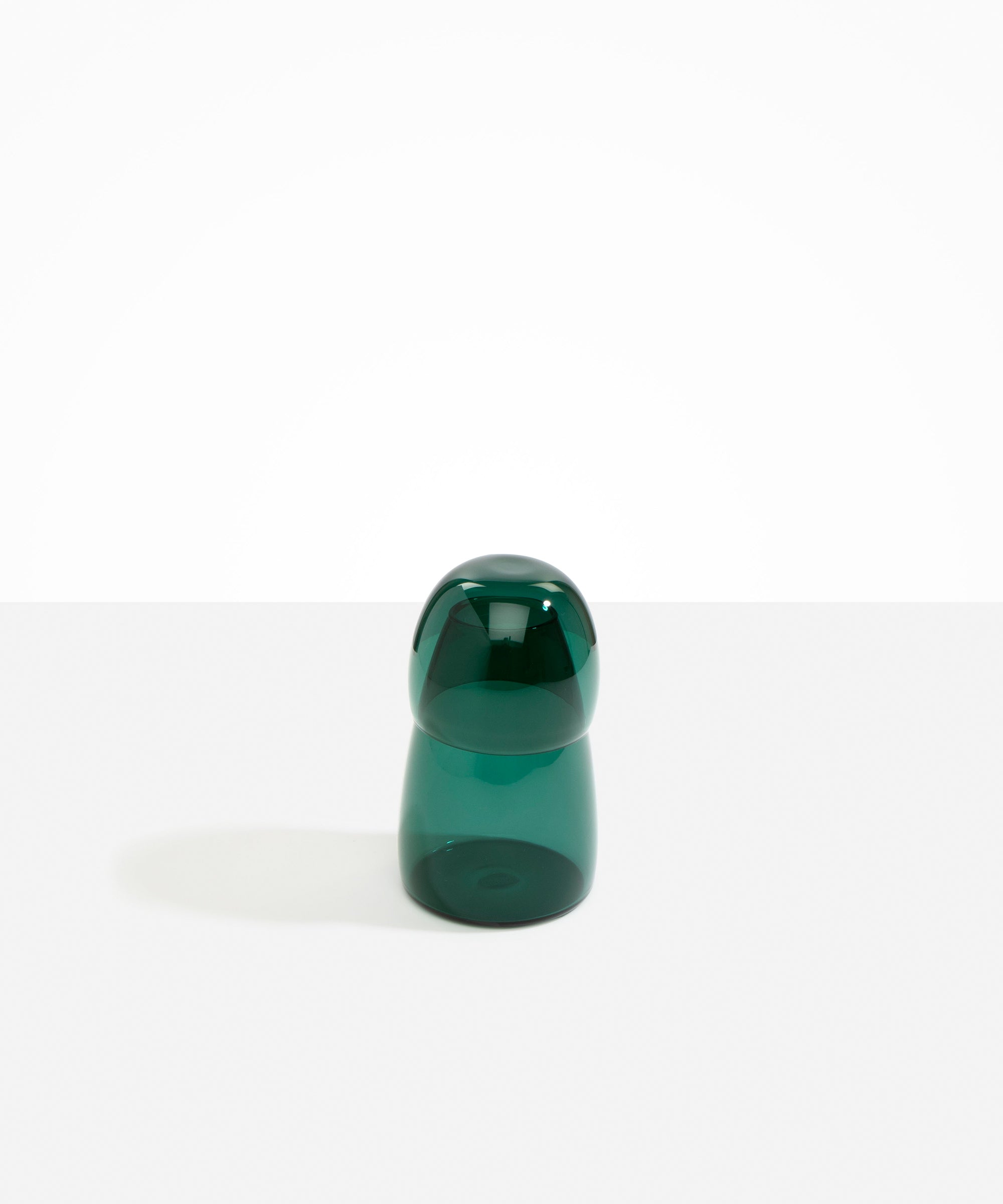 Dinosaur Designs colored Glass Pebble Carafe cup and jug set in transparent teal green.