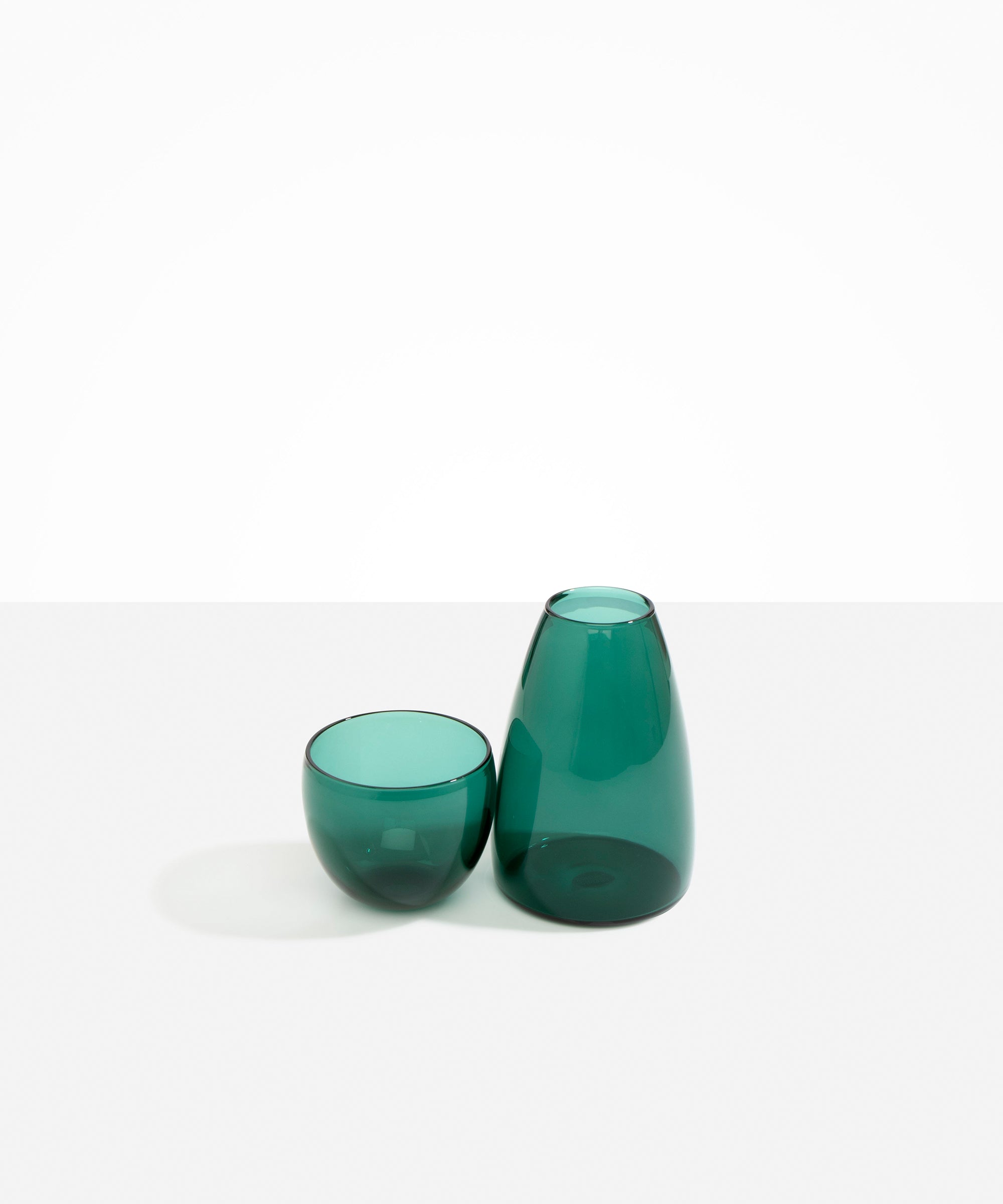 Dinosaur Designs Glass Pebble Carafe in Teal color resin