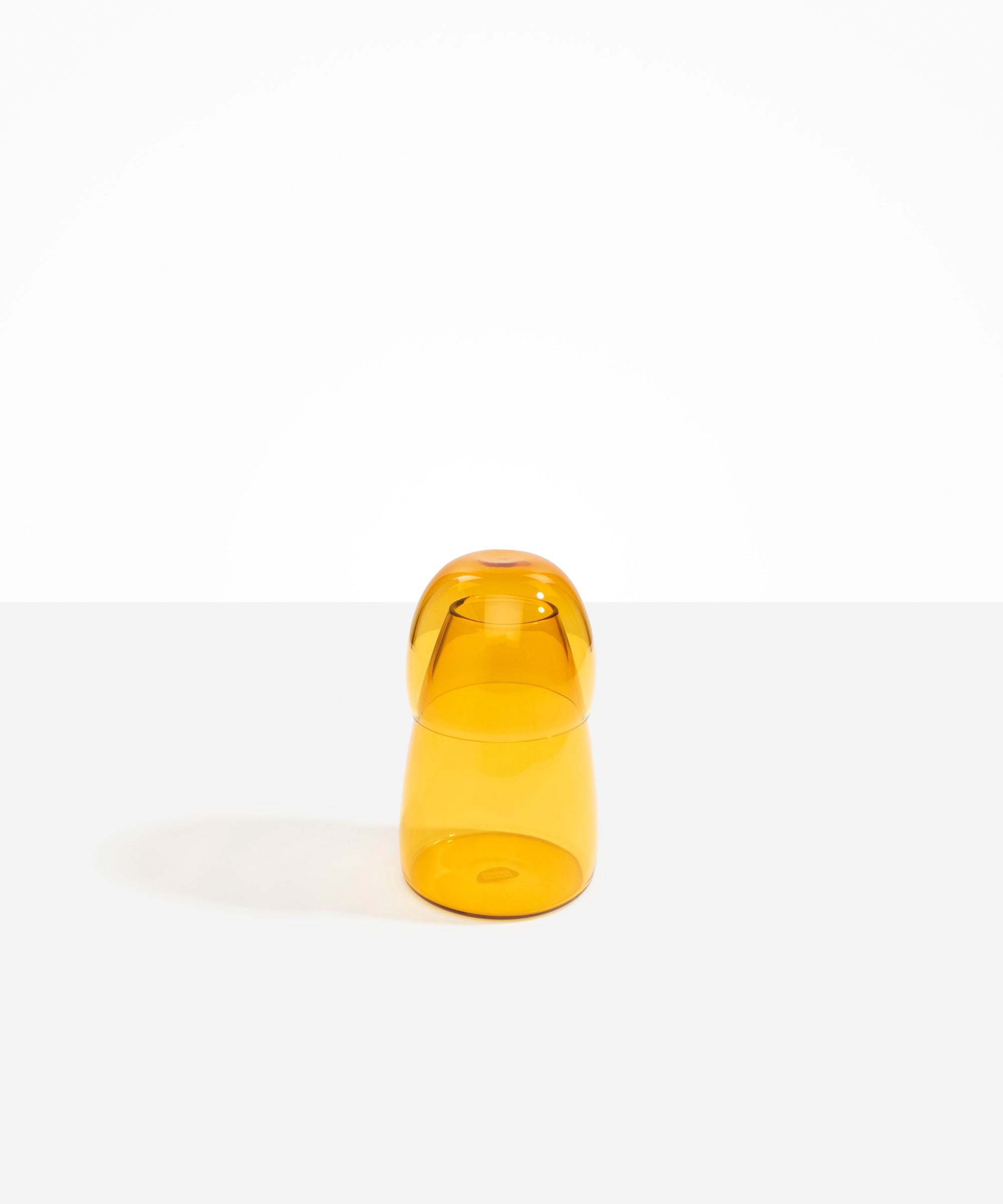 Dinosaur Designs colored Glass Pebble Carafe cup and jug set in transparent yellow.