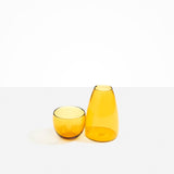 Dinosaur Designs Glass Pebble Carafe in Yellow color resin