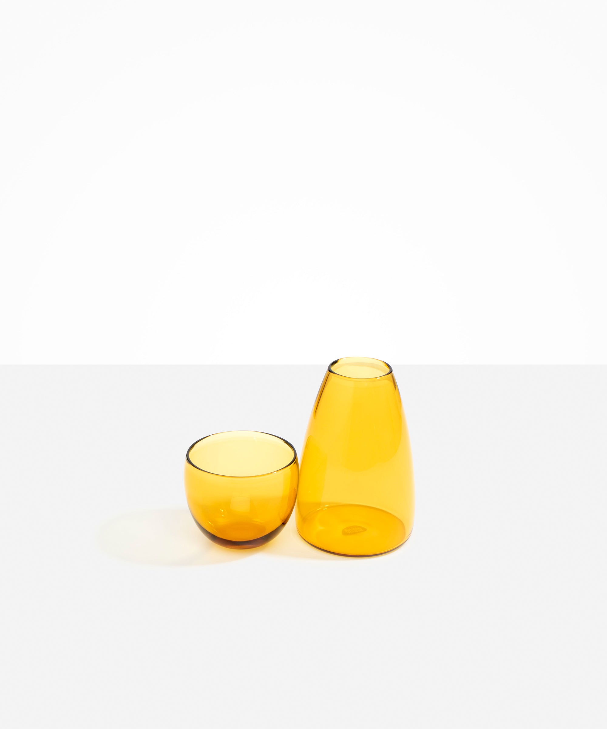 Dinosaur Designs Glass Pebble Carafe in Yellow color resin