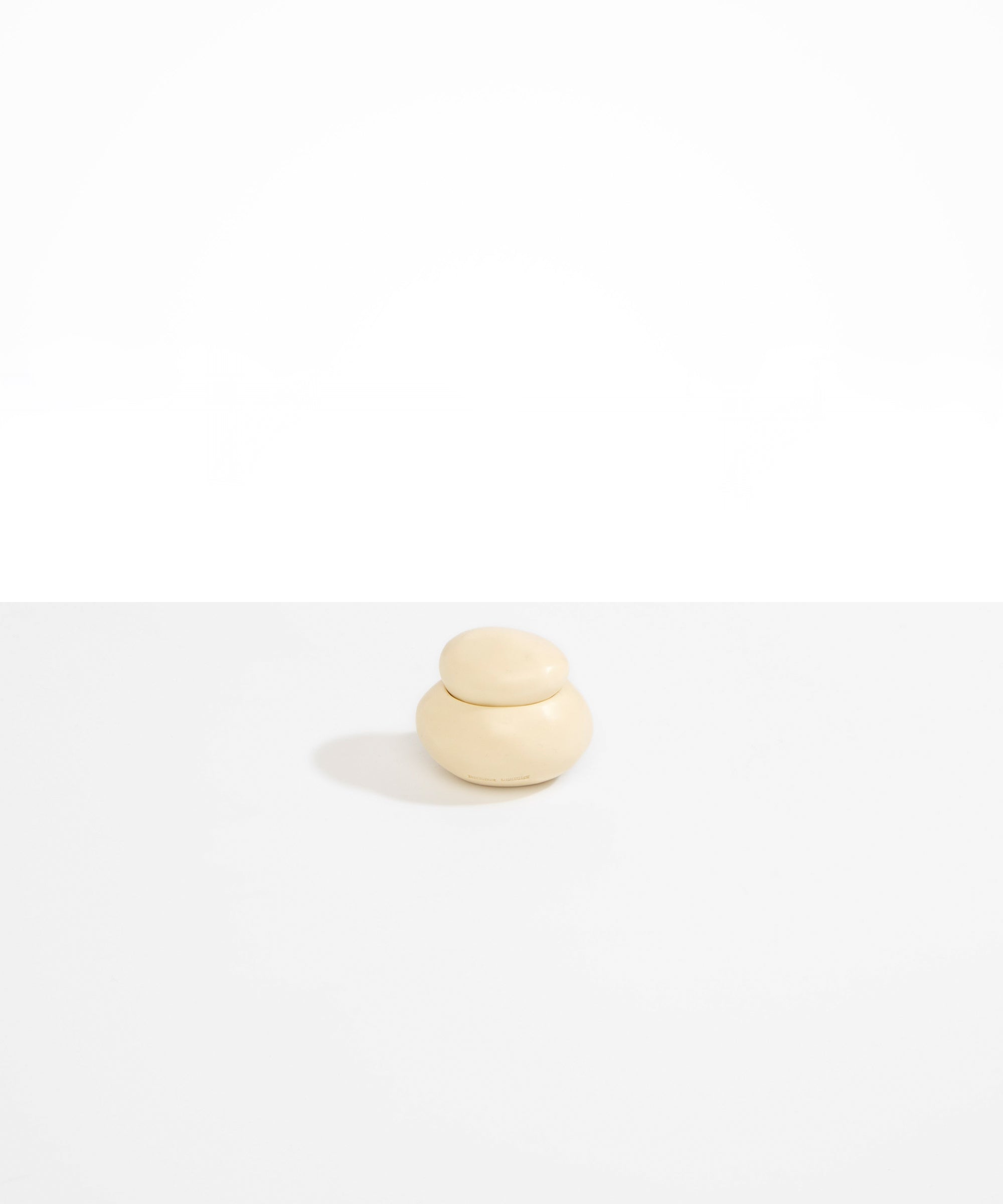 Dinosaur Designs Small Pebble Jar in Cream color resin