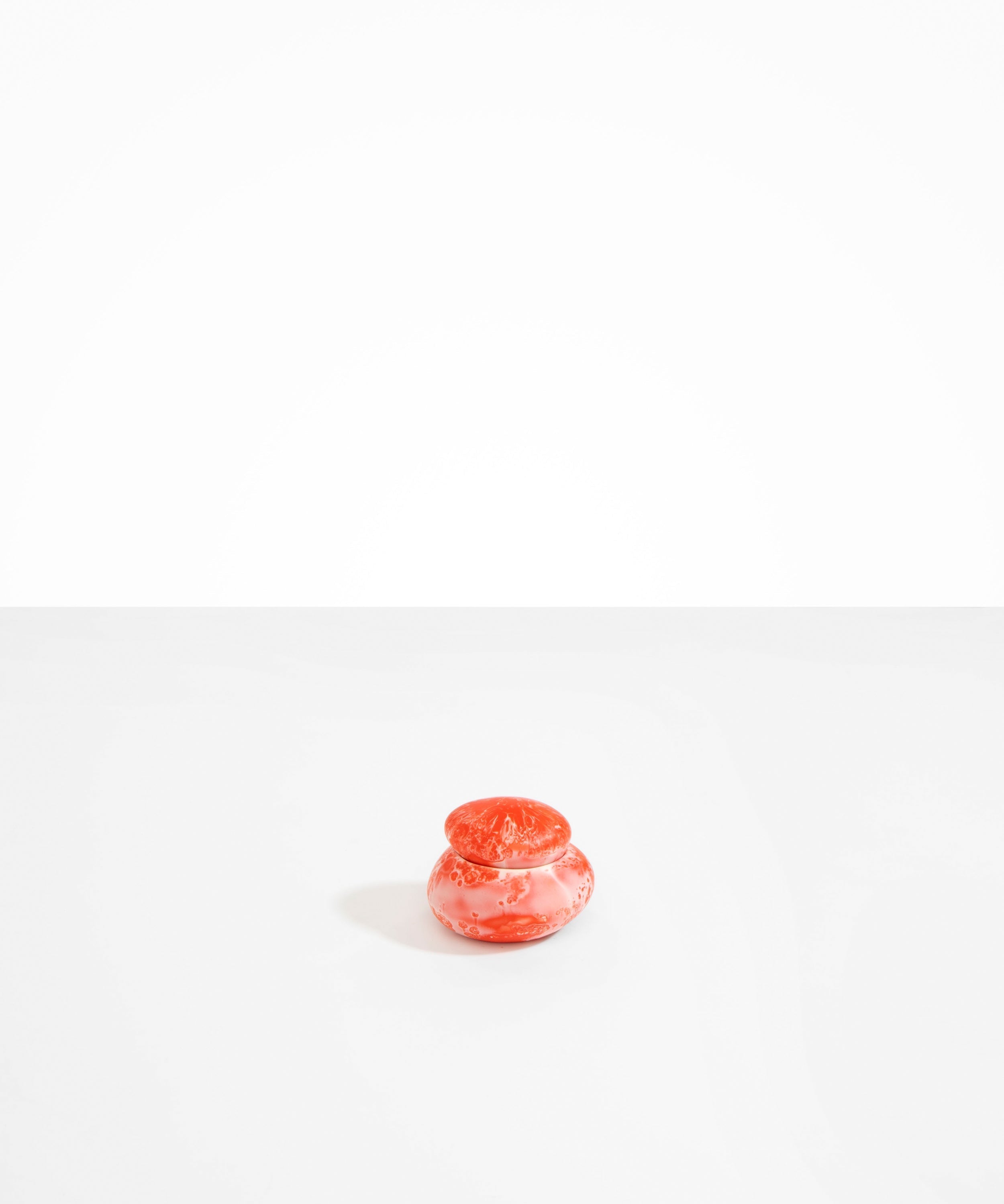 Dinosaur Designs Small Pebble Jar in Strawberry color resin