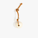 Dinosaur Designs Round Watercolor Bag Charm in Cream color resin with Brass Material