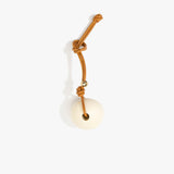 Dinosaur Designs Round Watercolor Bag Charm in Cream color resin with Brass Material