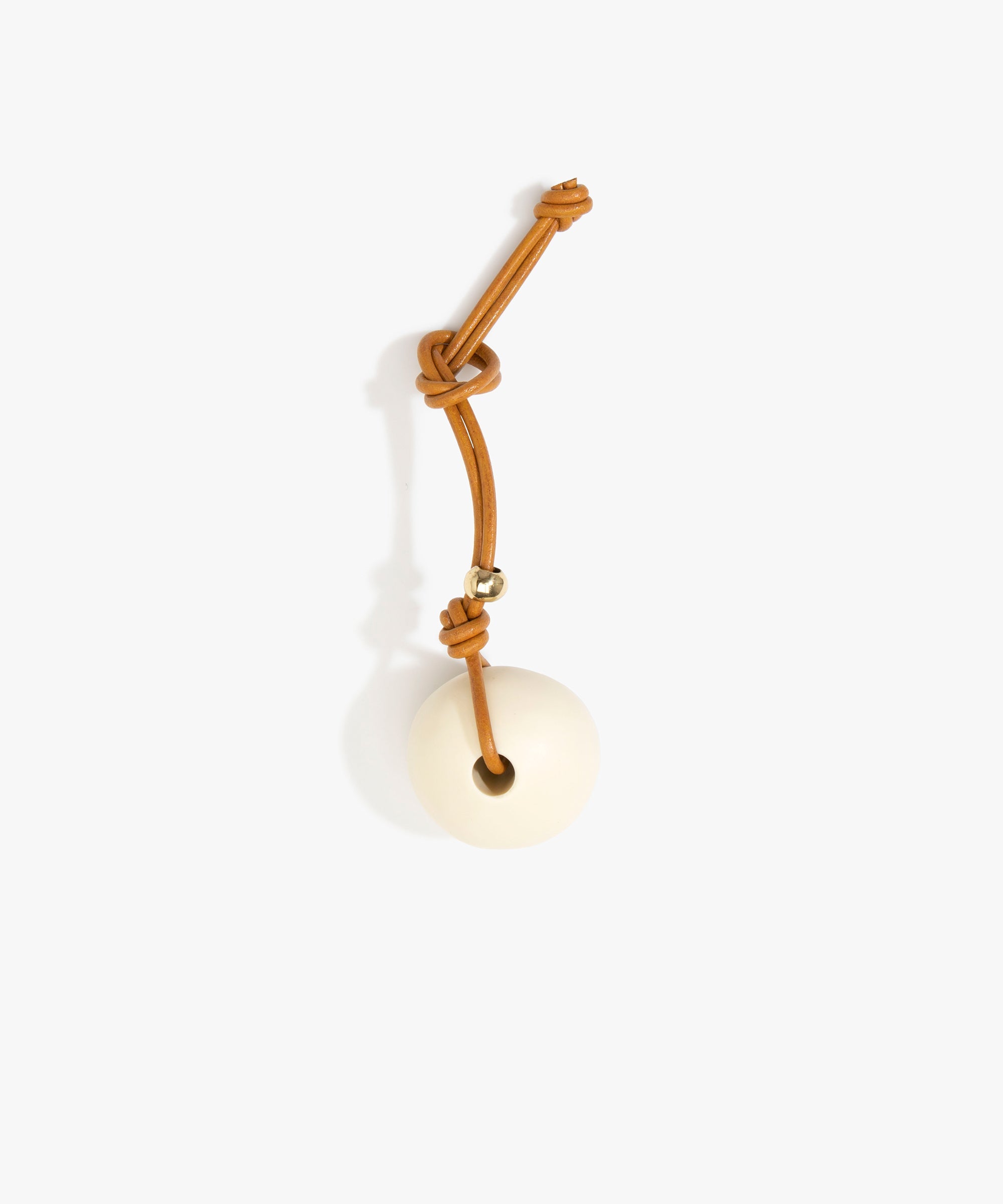 Dinosaur Designs Round Watercolor Bag Charm in Cream color resin with Brass Material