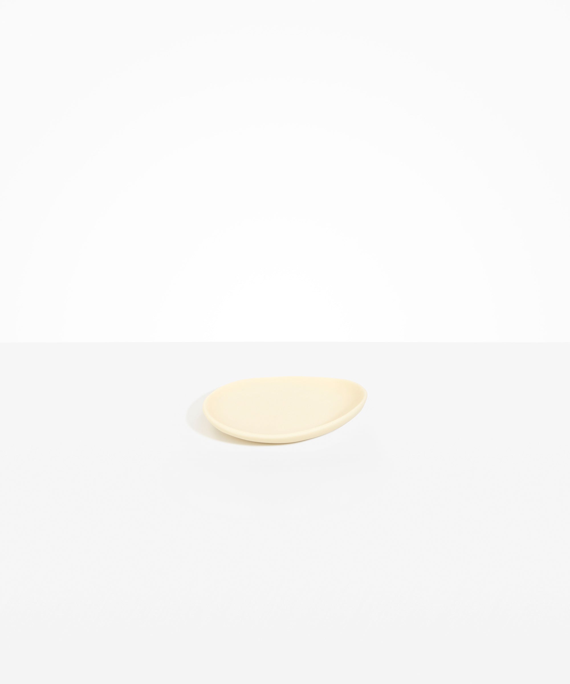 Dinosaur Designs Pebble Side Plate in Cream color resin