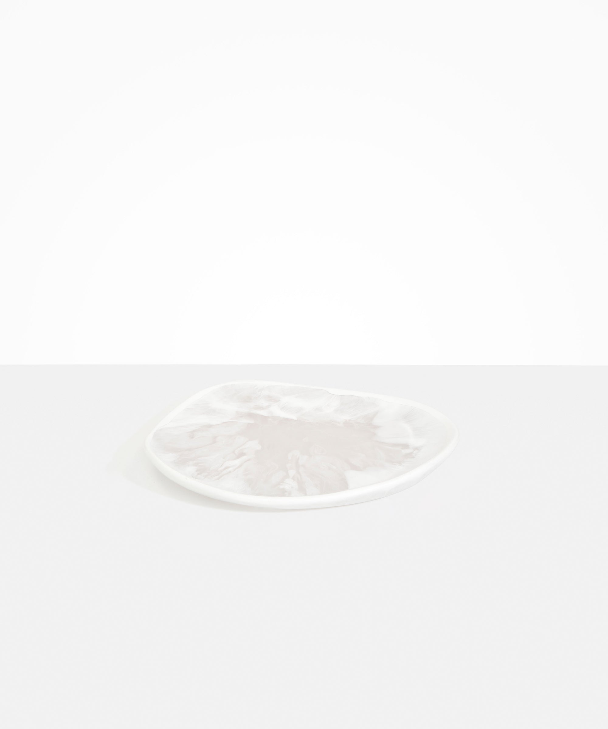 Dinosaur Designs Pebble Plate in Snow Swirl color resin