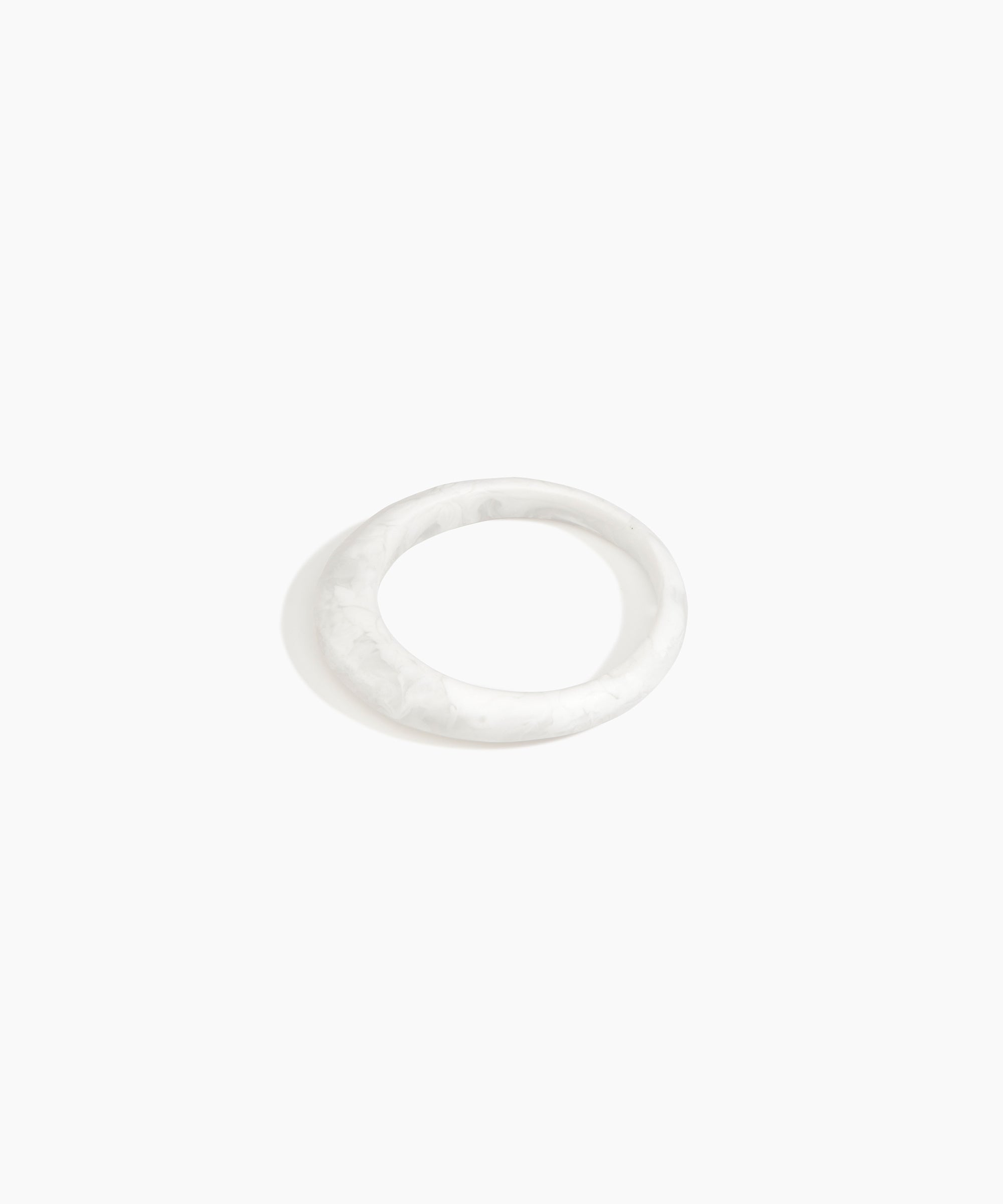 Dinosaur Designs Small Organic Bangle in Snow Swirl color resin with Regular Fit