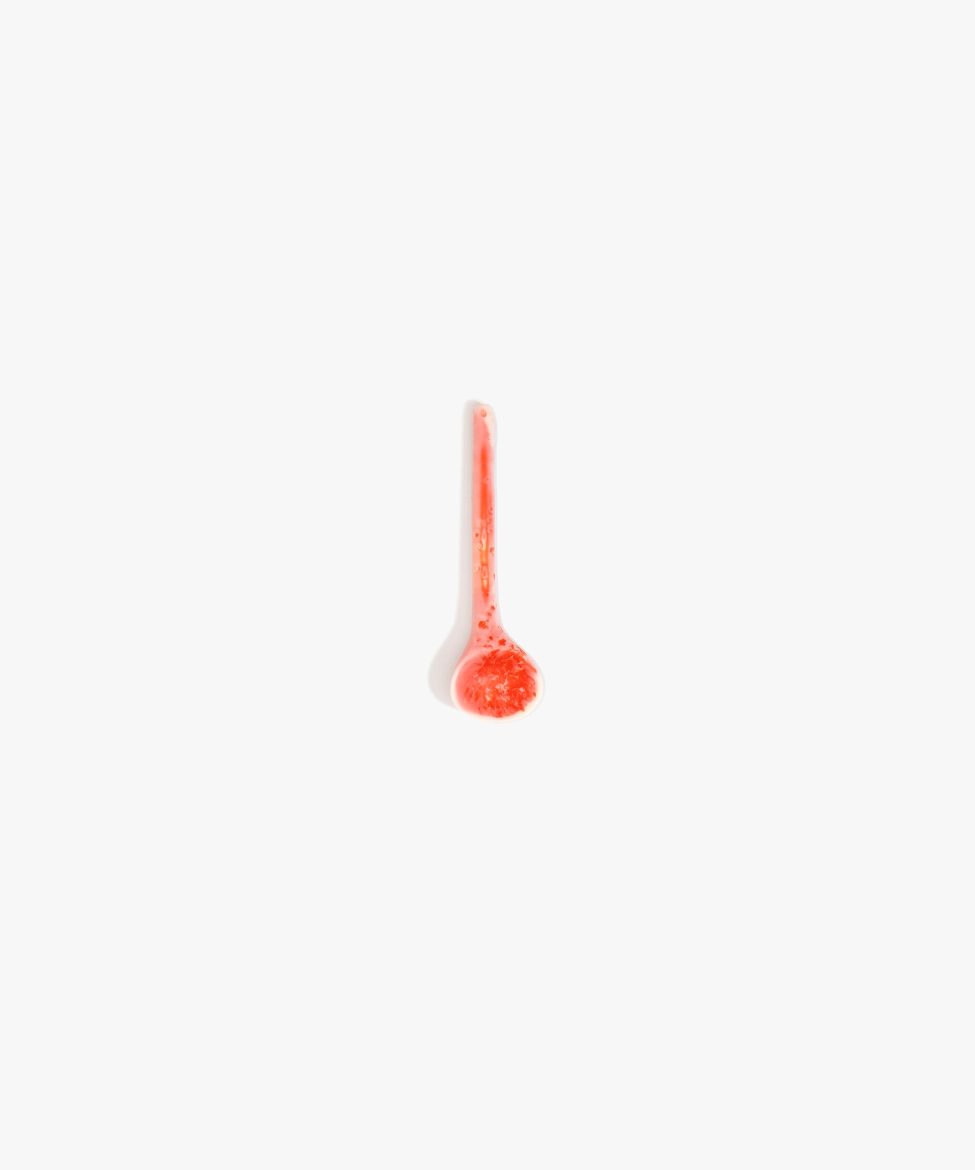 Dinosaur Designs Temple Spoon in Strawberry color resin