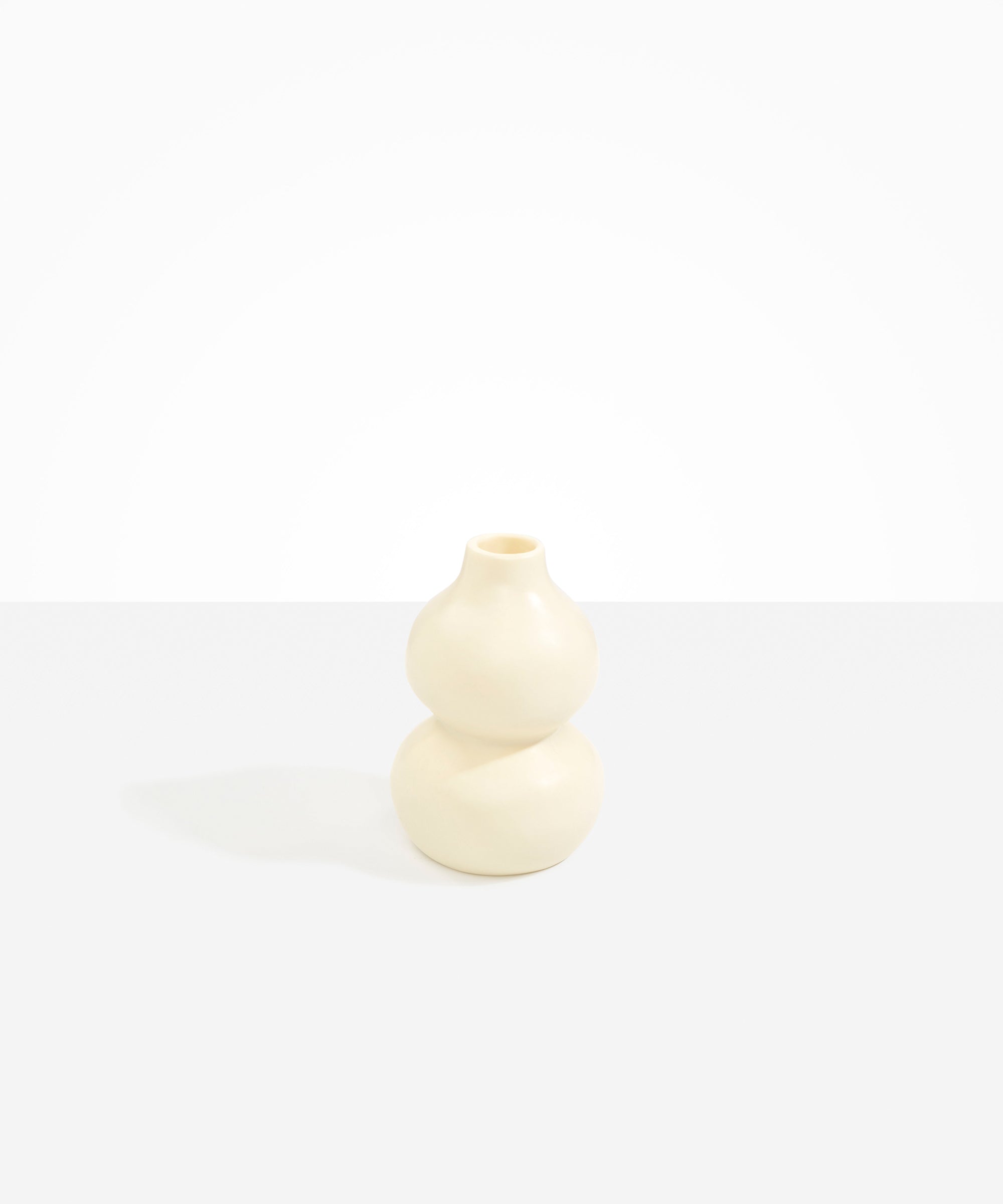 Dinosaur Designs Lotus Seed Vase in Cream color resin