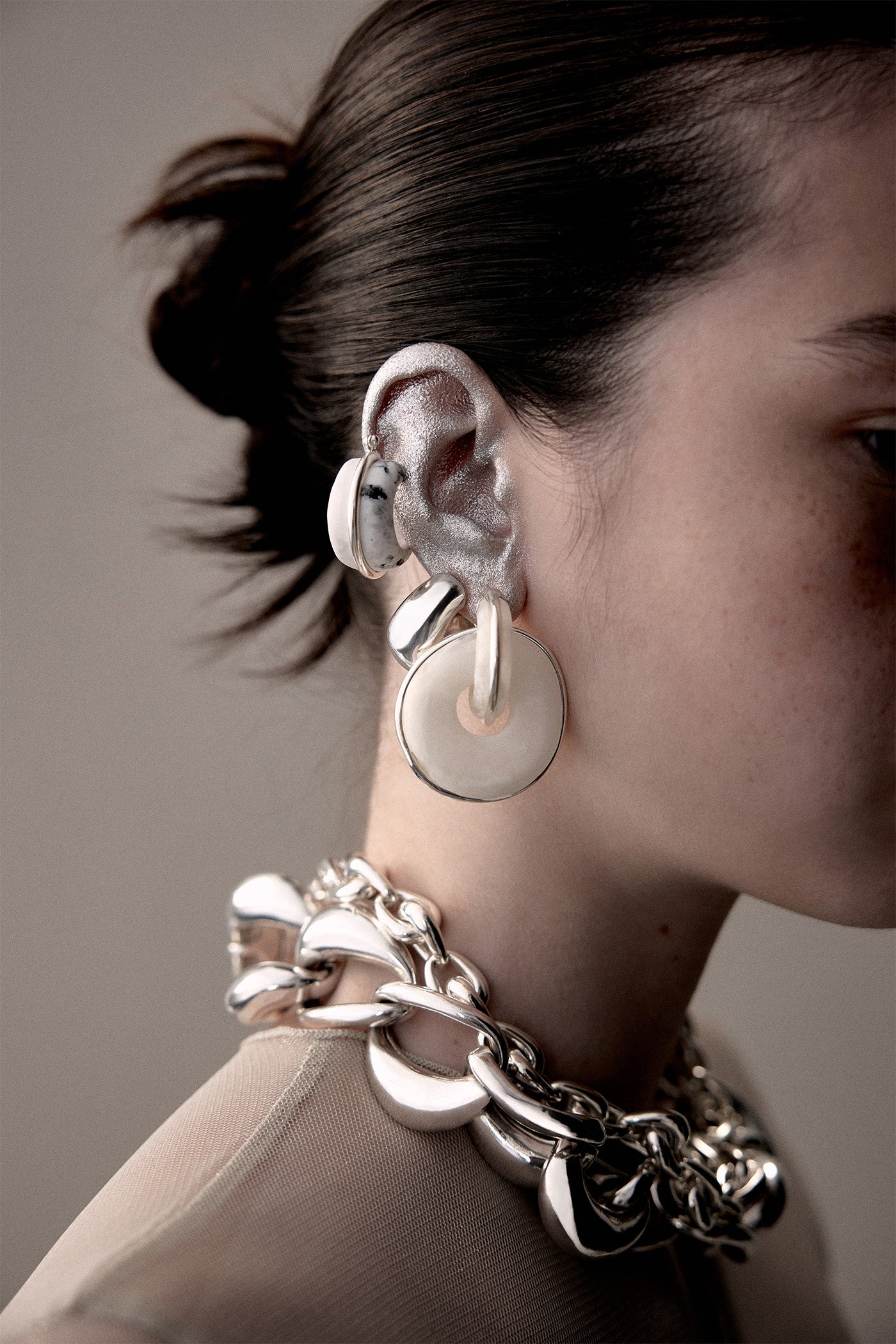 Daisy style earrings styled in a dragonfruit.