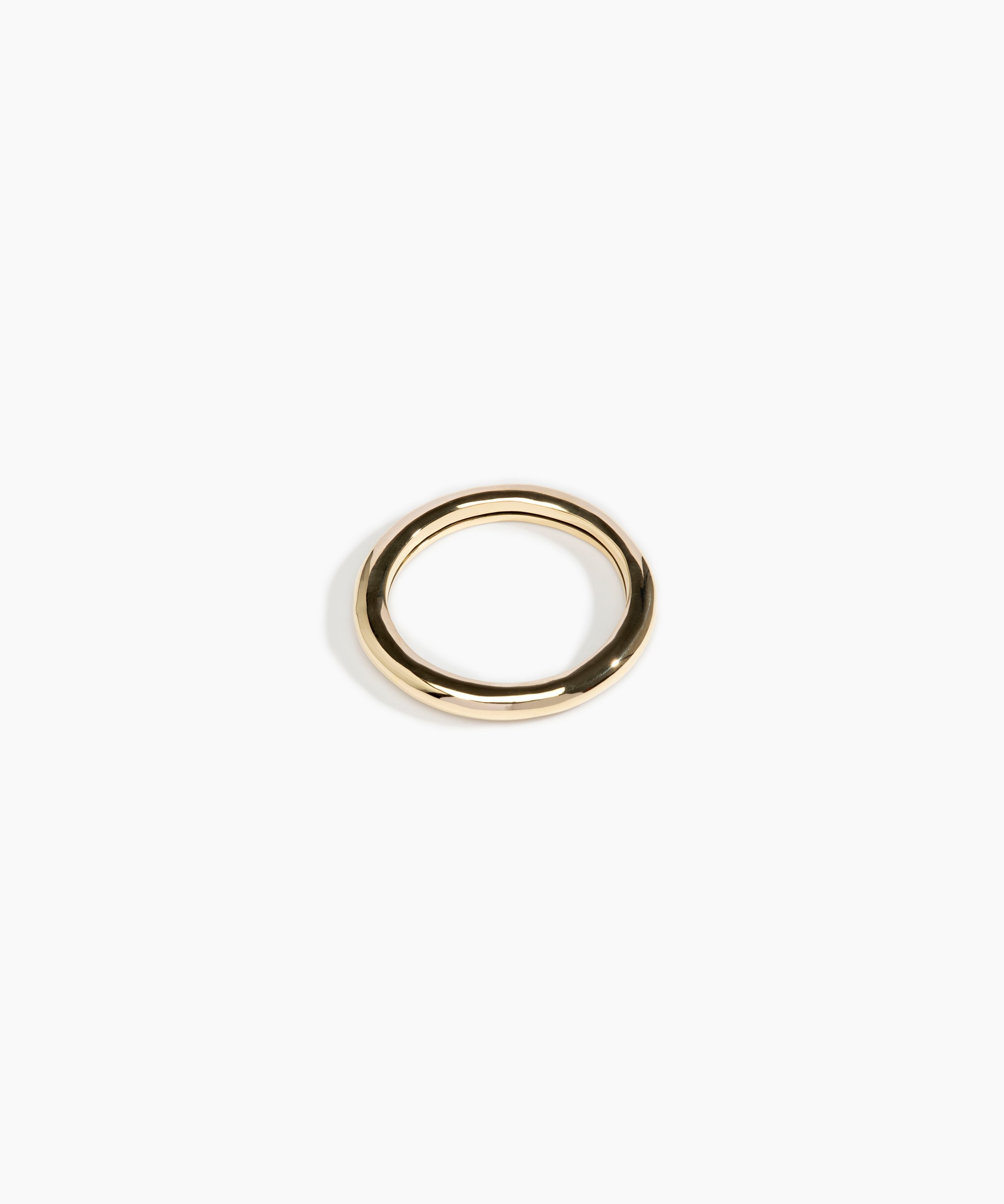Dinosaur Designs Wishbone Bangle in Nano-Coated Brass Material..