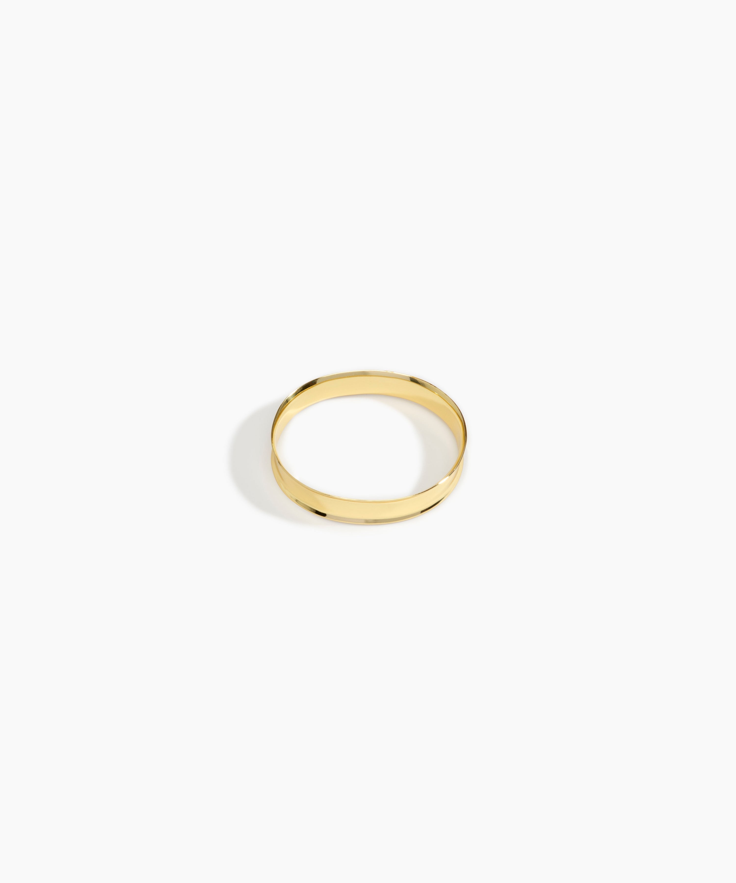 LO Collections x ALEX AND TRAHANAS Narrow Voyage Bangle in Nano-Coated Brass Material....