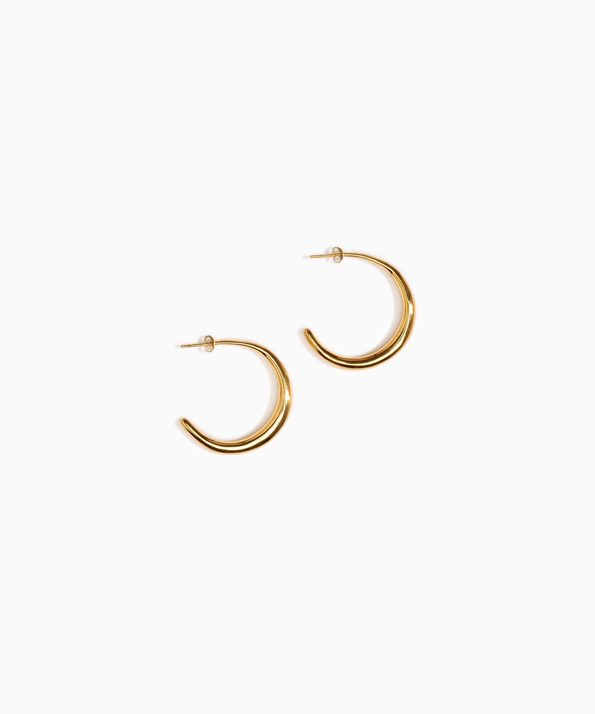 LO Collections Large Liquid Hoop Earrings in 24k Gold-Plated Brass Material..