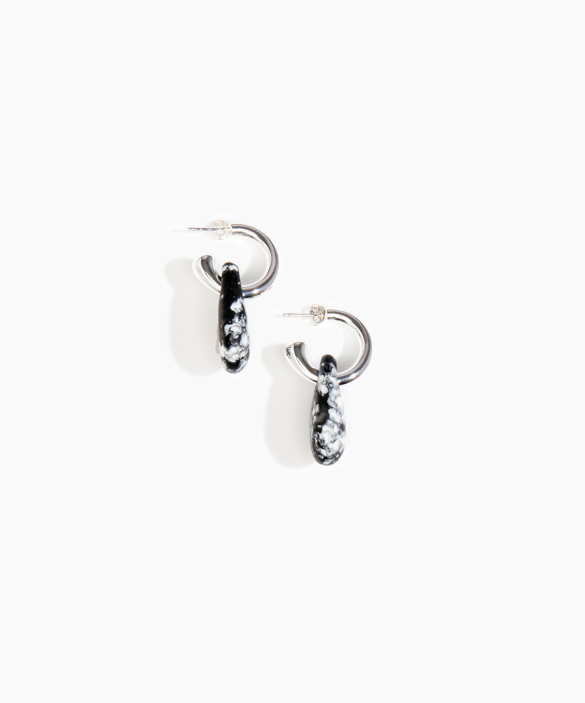 Dinosaur Designs Small Rock Hoop Earrings in Black Marble Colour resin with Silver-Plated Brass Hoop Material.