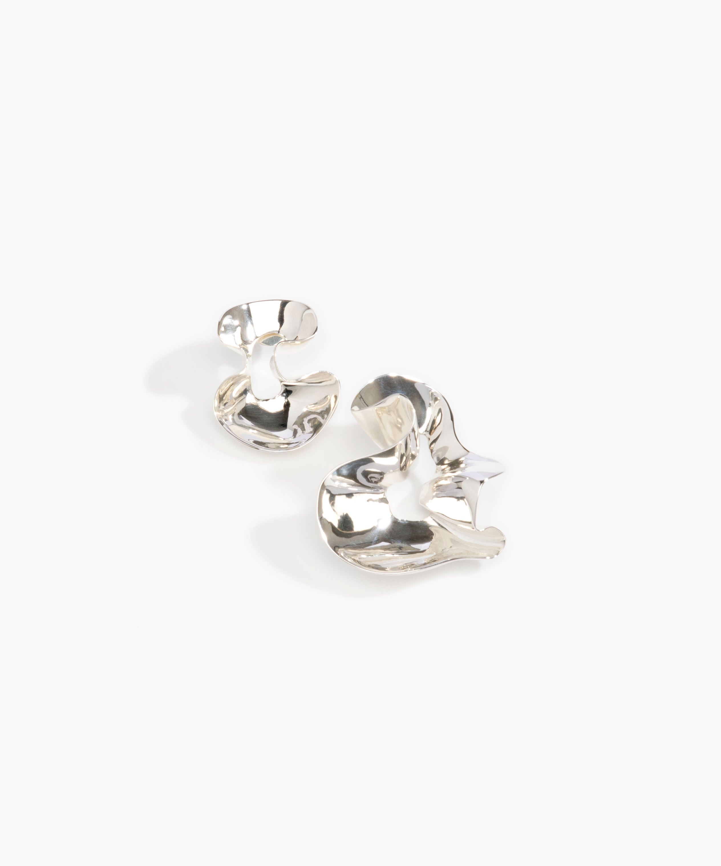 LO Collections Wave Earrings in Silver-Plated Brass Material..