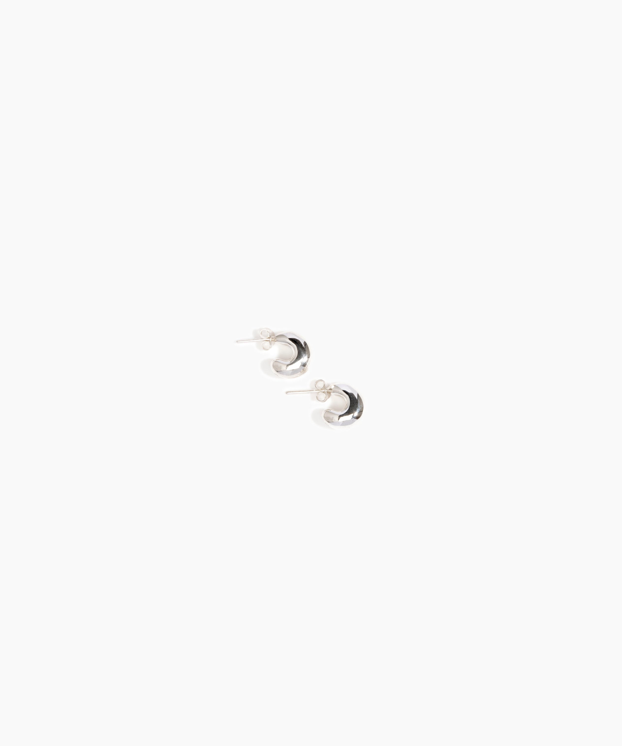 LO Collections Small Liquid Loop Earrings in Silver-Plated Brass Material..