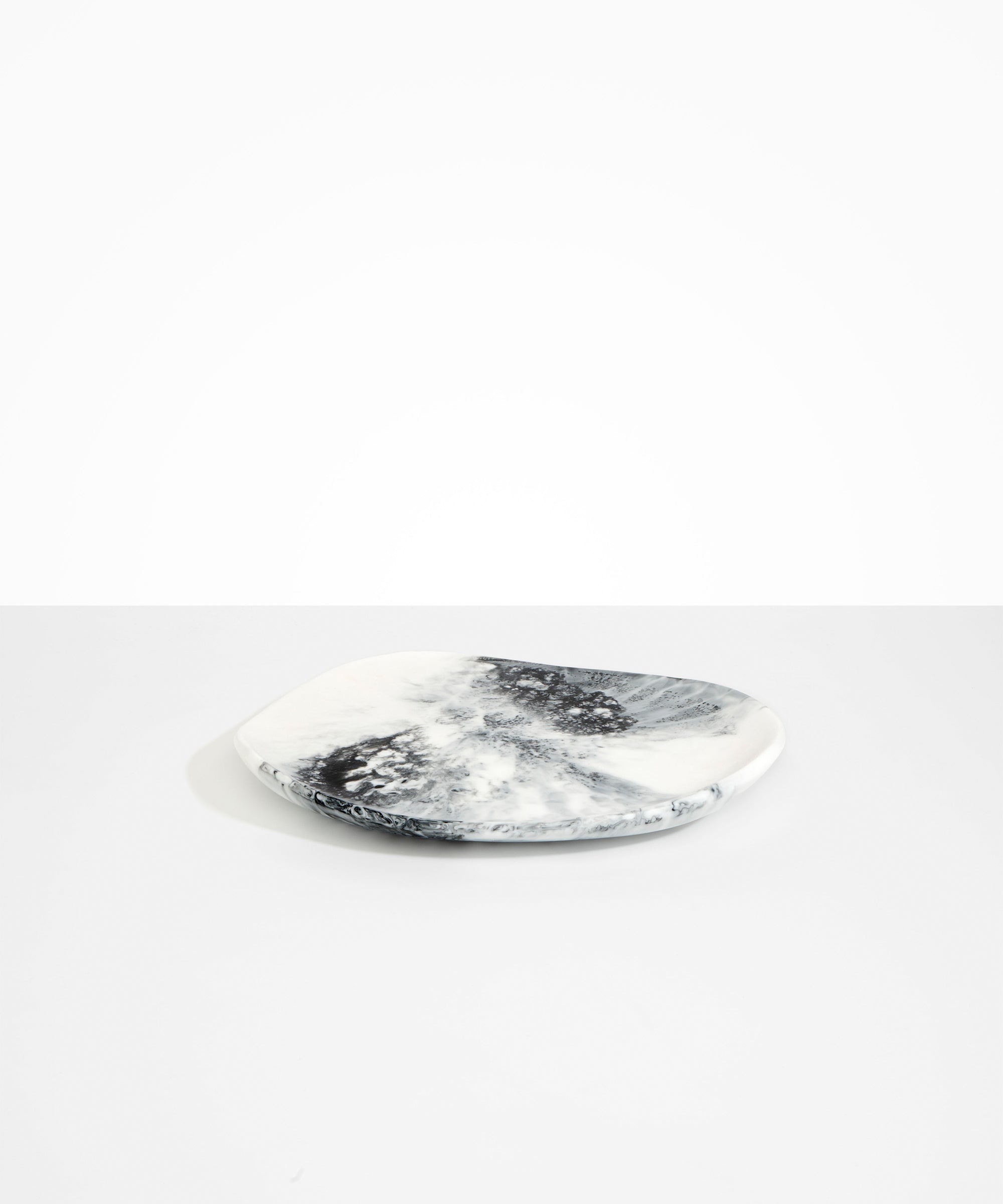 Dinosaur Designs Pebble Plate in White Marble Colour resin.