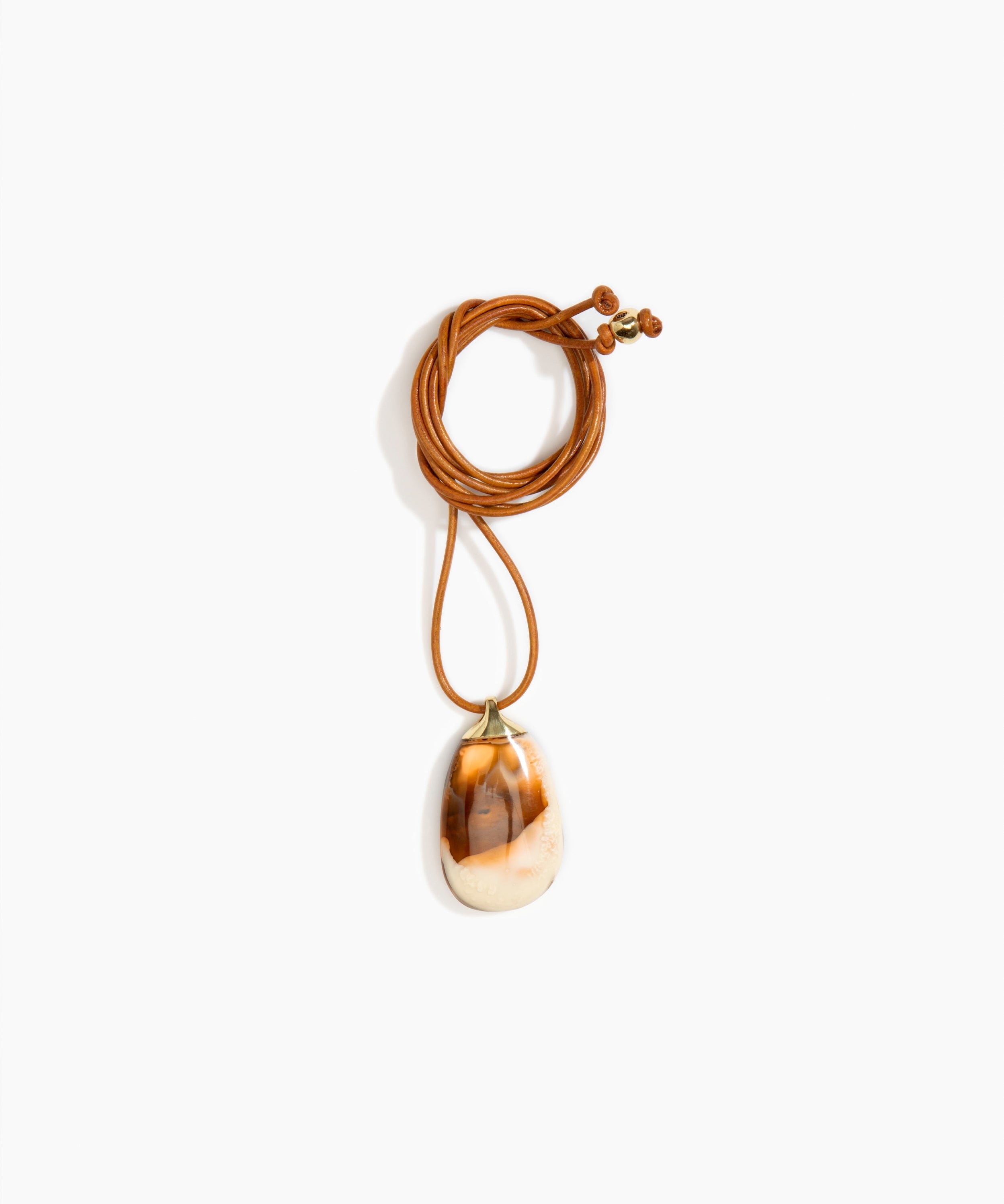 Dinosaur Designs River Rock Pendant on Leather in Light Horn color resin