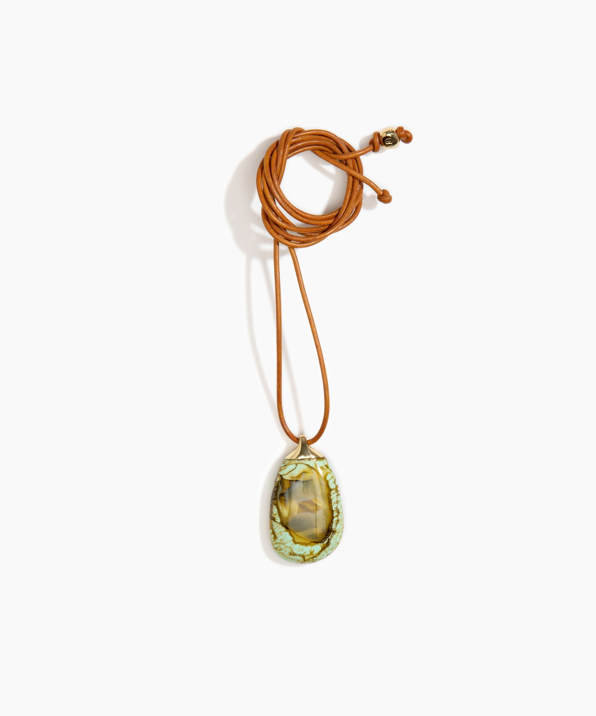 Dinosaur Designs River Rock Pendant on Leather in Malachite color resin