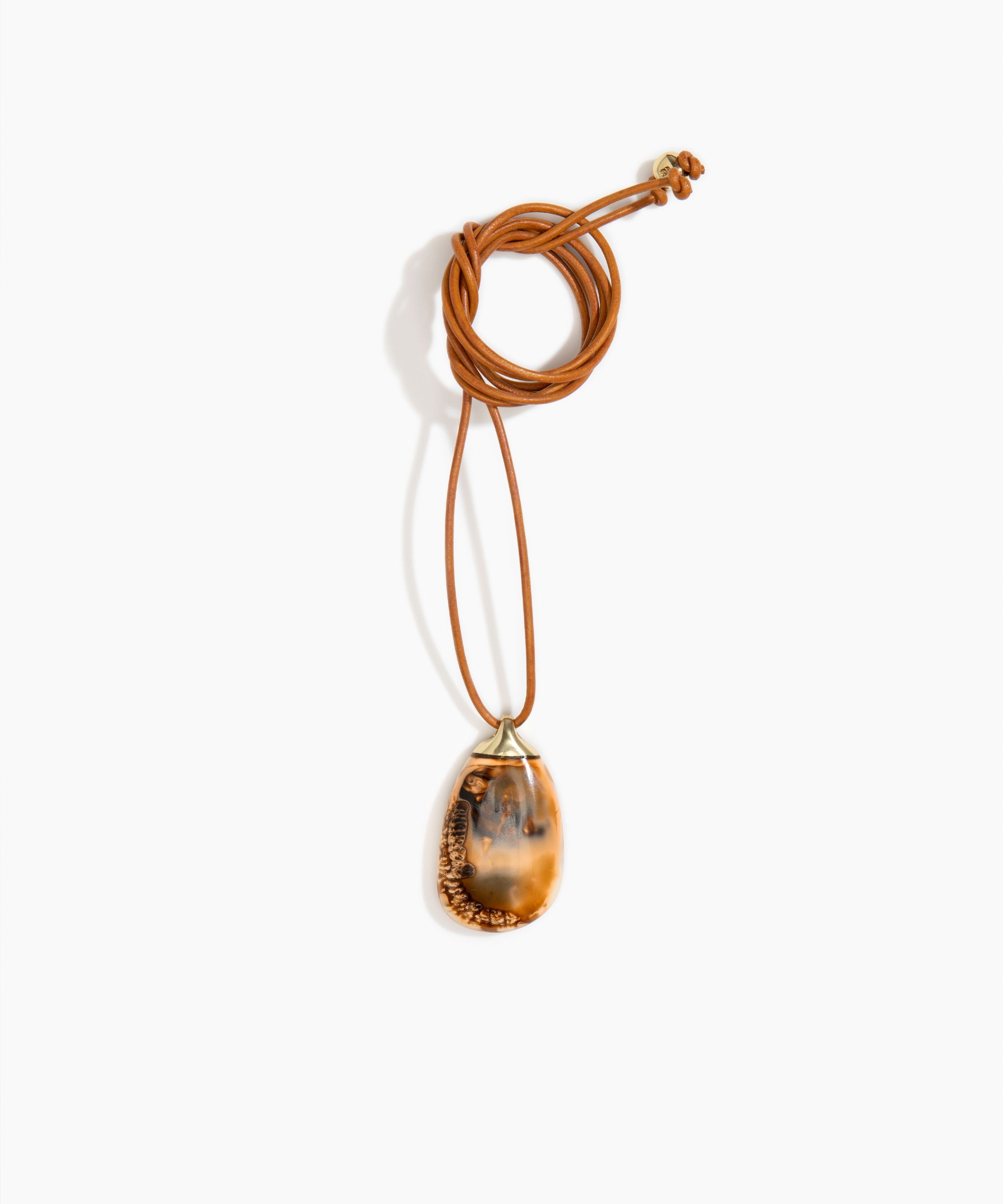 Dinosaur Designs River Rock Pendant on Leather in Dark Horn Colour resin.