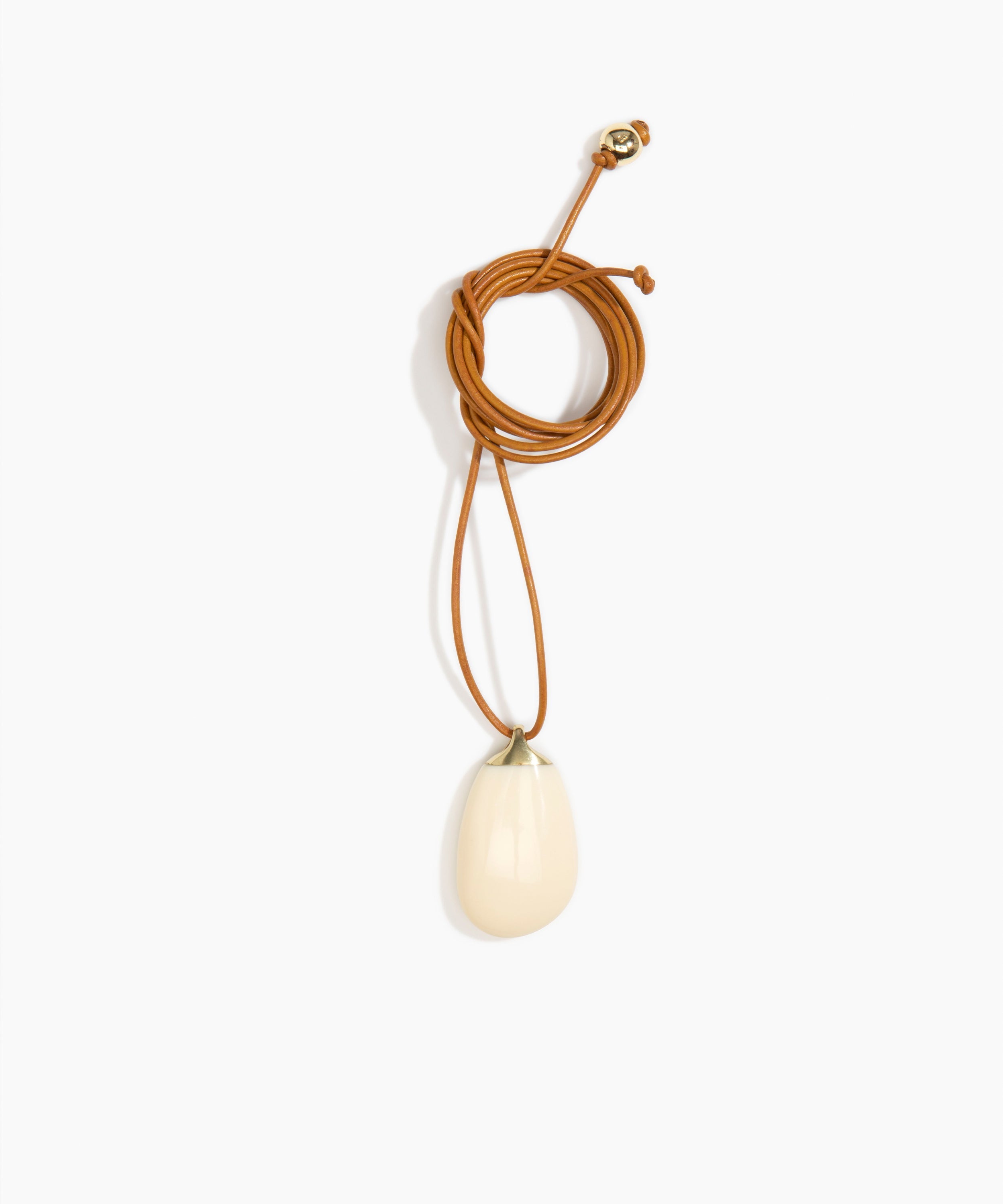 Dinosaur Designs River Rock Pendant on Leather in Cream Colour resin.