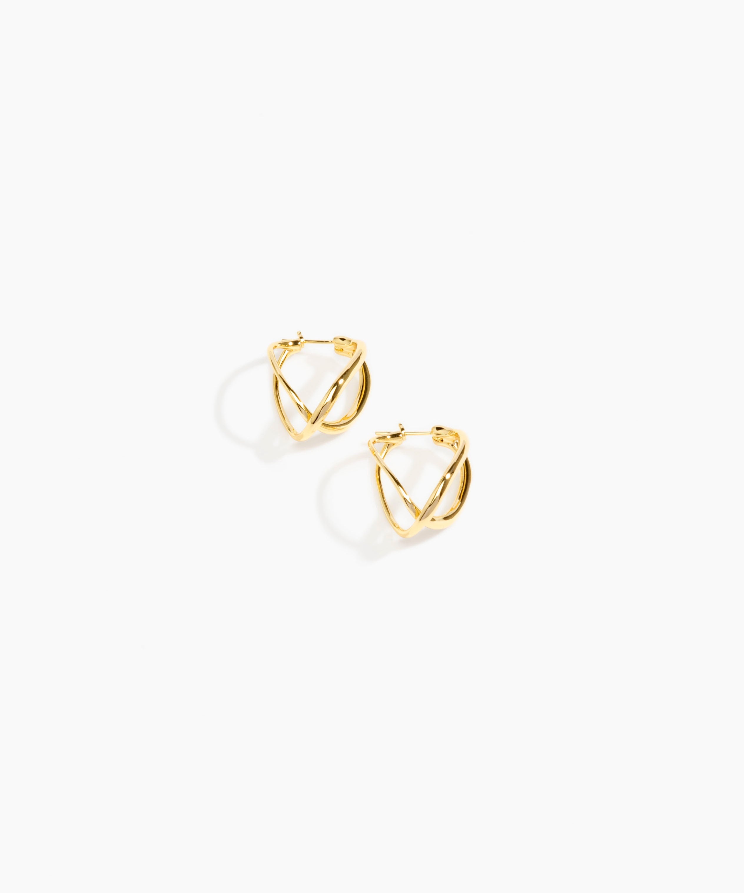 Dinosaur Designs and Alex & Trahanas Medium Corda Earrings in Brass — polished gold-toned brass hoop earrings with interlinked twisted loop design.