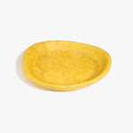 Dinosaur Designs Large Bones Bowl in Pollen — handmade marbled yellow resin shallow serving bowl with a rounded organic form...