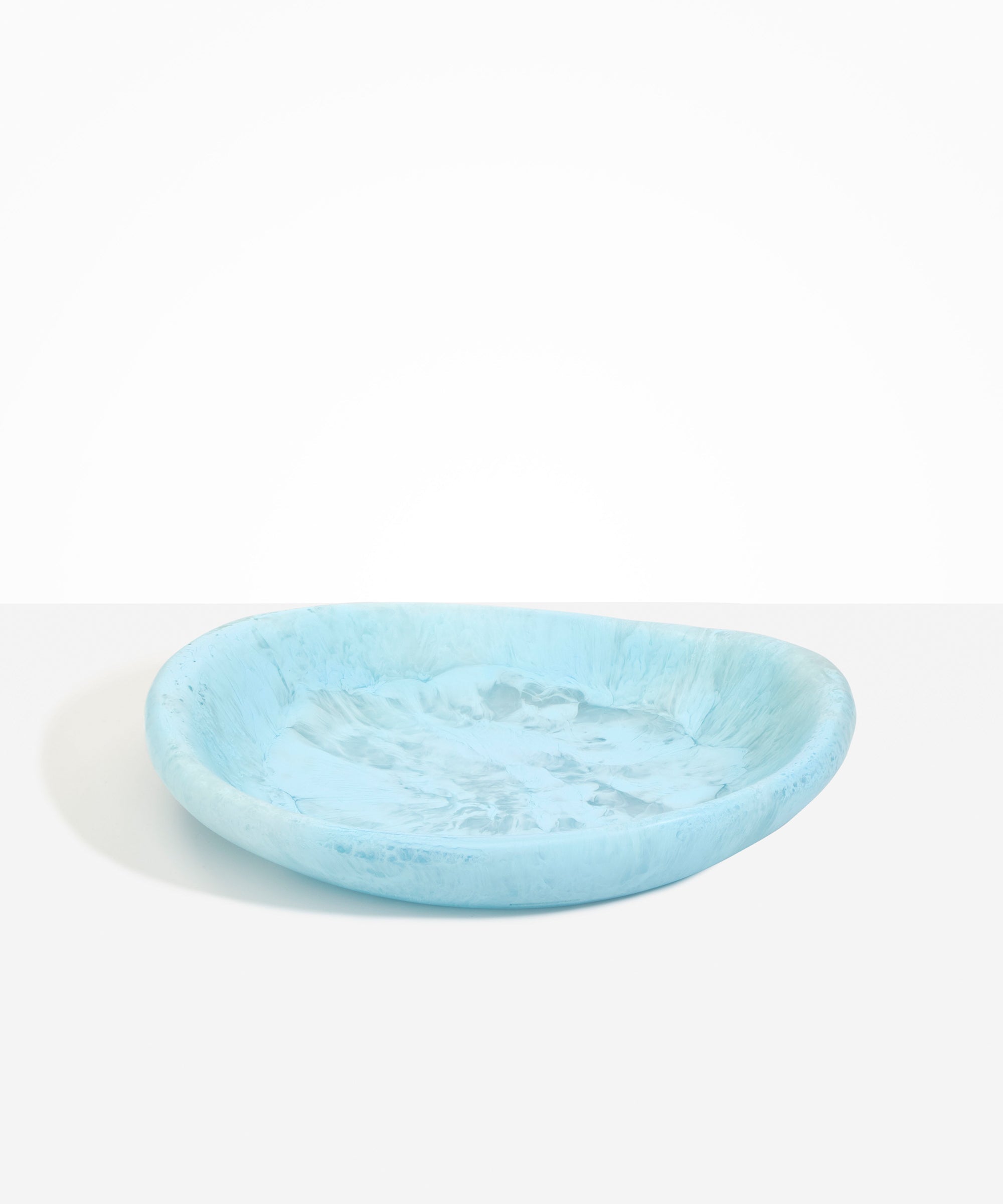 Dinosaur Designs Large Bones Bowl in Pool — handmade marbled blue resin shallow serving bowl with a rounded organic form...