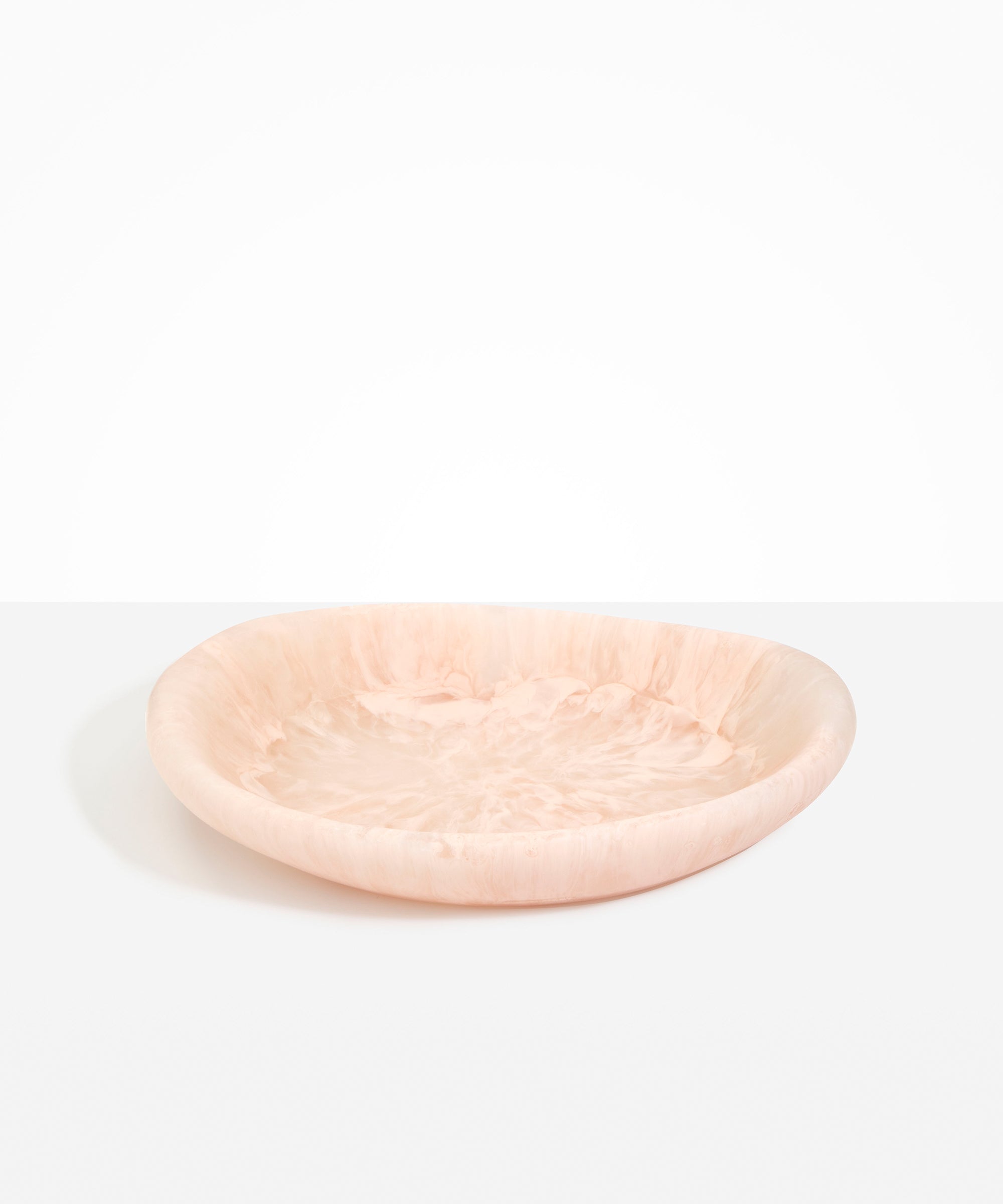 Dinosaur Designs Large Bones Bowl in Rose Swirl — handmade pink resin shallow serving bowl with a rounded organic form..