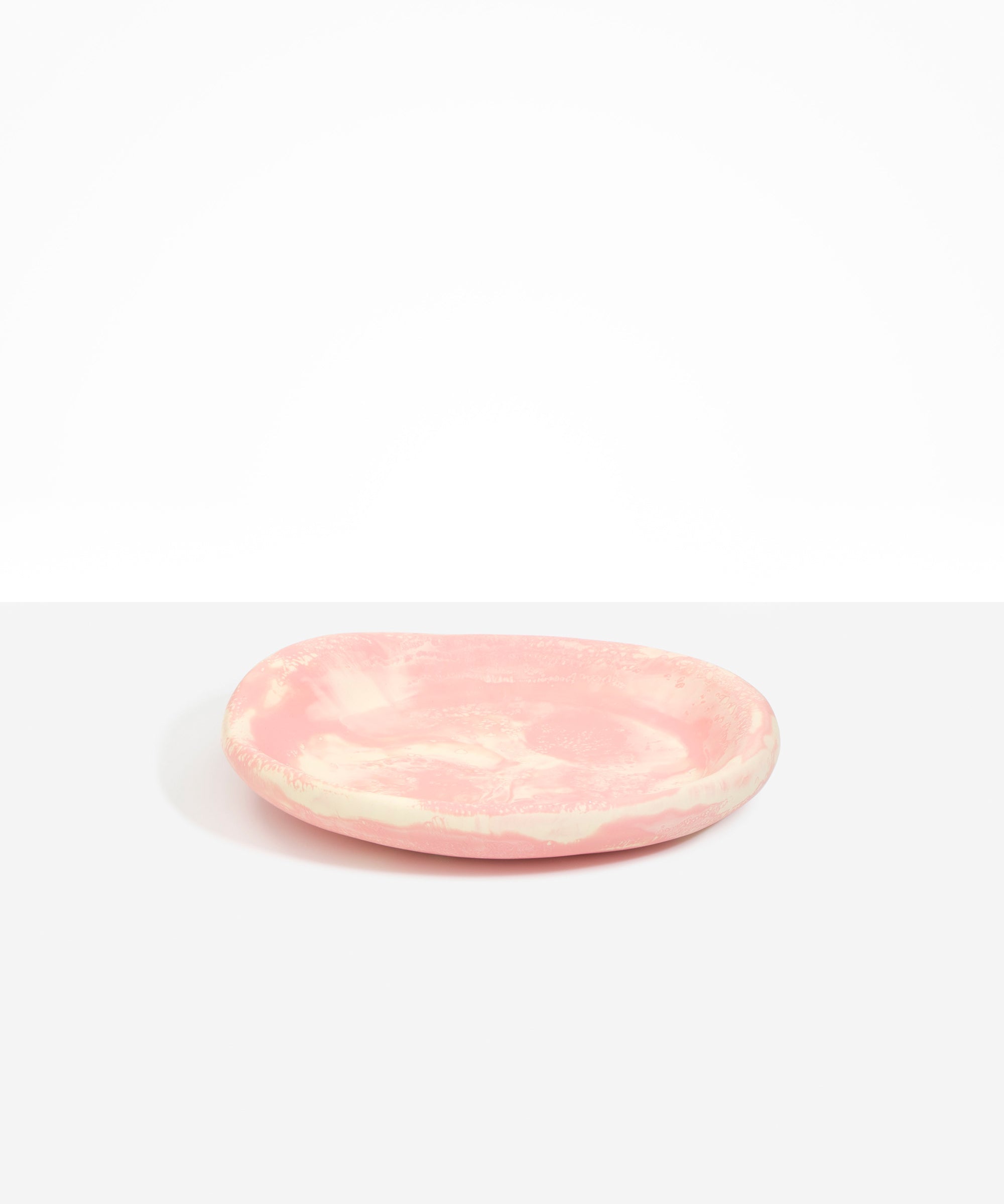 Dinosaur Designs Medium Bones Bowl in Blossom — mid sized handmade marbled pink and cream resin shallow serving bowl with a rounded organic form