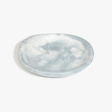 Dinosaur Designs Medium Bones Bowl in Cloud — mid sized handmade marbled cream and grey resin shallow serving bowl with a rounded organic form..