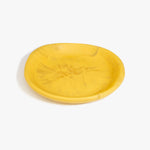 Dinosaur Designs Medium Bones Bowl in Pollen — mid sized handmade marbled yellow resin shallow serving bowl with a rounded organic form..
