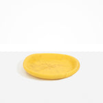 Dinosaur Designs Medium Bones Bowl in Pollen — mid sized handmade marbled yellow resin shallow serving bowl with a rounded organic form..