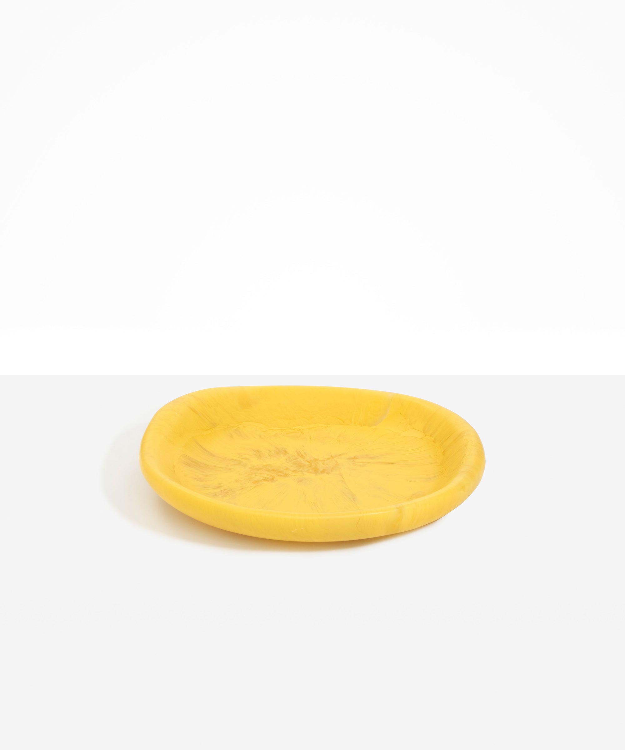 Dinosaur Designs Medium Bones Bowl in Pollen — mid sized handmade marbled yellow resin shallow serving bowl with a rounded organic form..